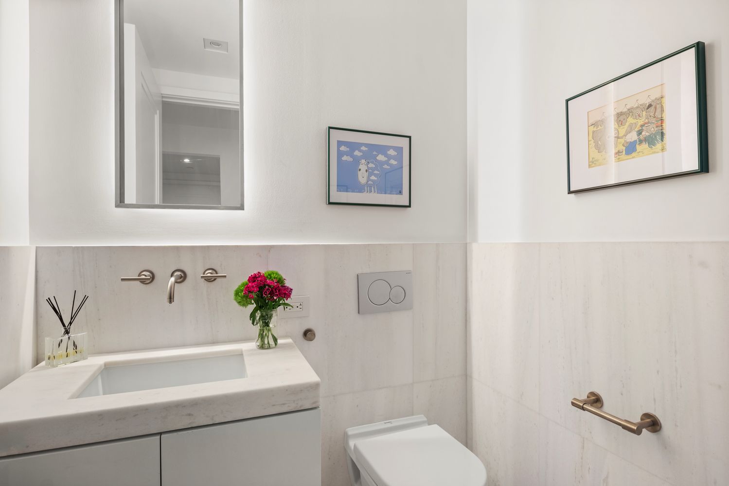 101 Wall Street, Unit 5BE Manhattan, NY 10005 - Photo 8 of 16 a bathroom with a sink mirror and a toilet