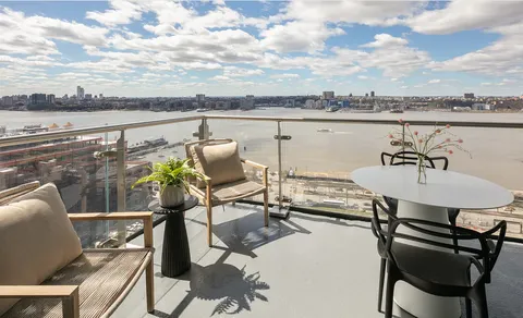 a view of a terrace with furniture and stove