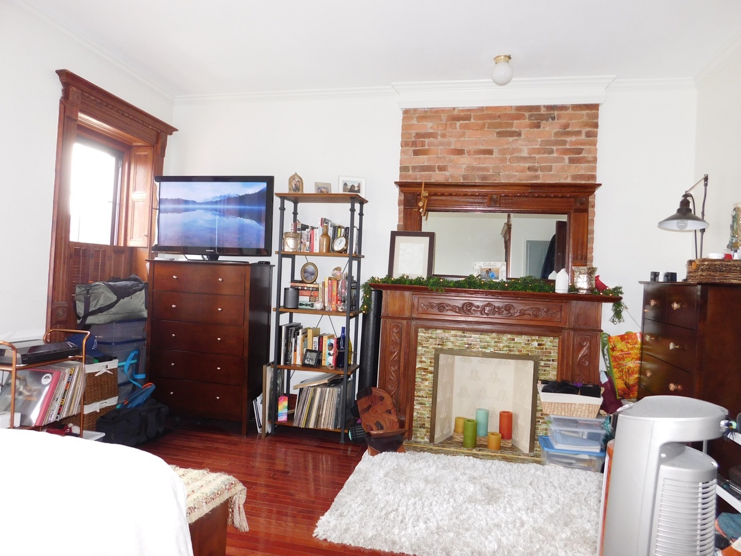 132 Underhill Avenue, Unit 2 Brooklyn, NY 11238 - Photo 6 of 9 a living room with furniture and a fireplace