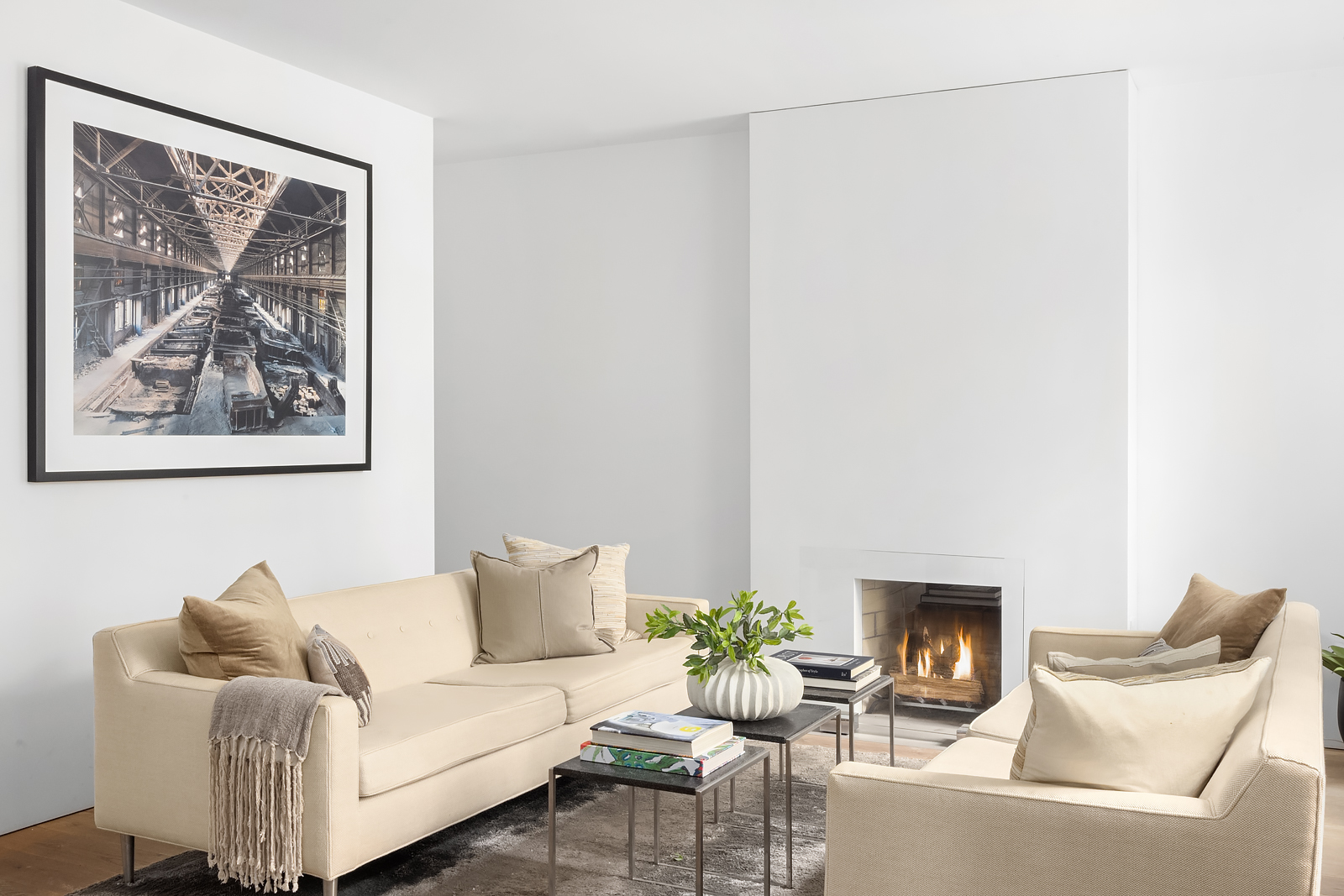 130 Charles Street Manhattan, NY 10014 - Photo 2 of 14 a living room with furniture and a fireplace