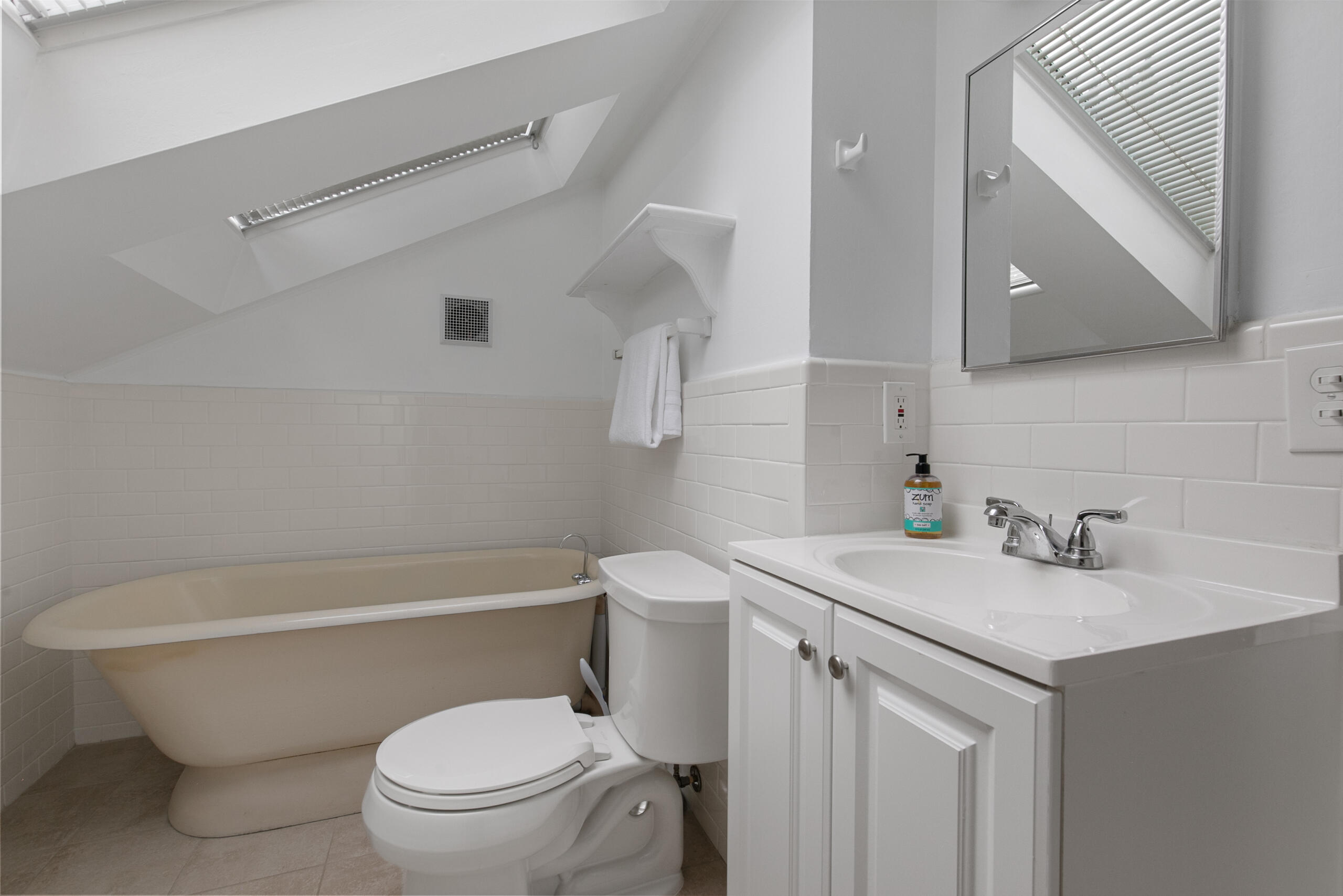 1908 Glen Ross Road Silver Spring, MD 20910 - Photo 38 of 63 a bathroom with a sink a toilet and a mirror