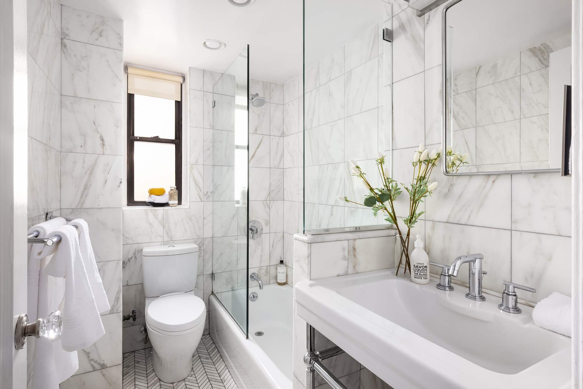 49 East 96th Street, Unit 9B Manhattan, NY 10128 - Photo 14 of 15 a bathroom with a sink toilet and shower