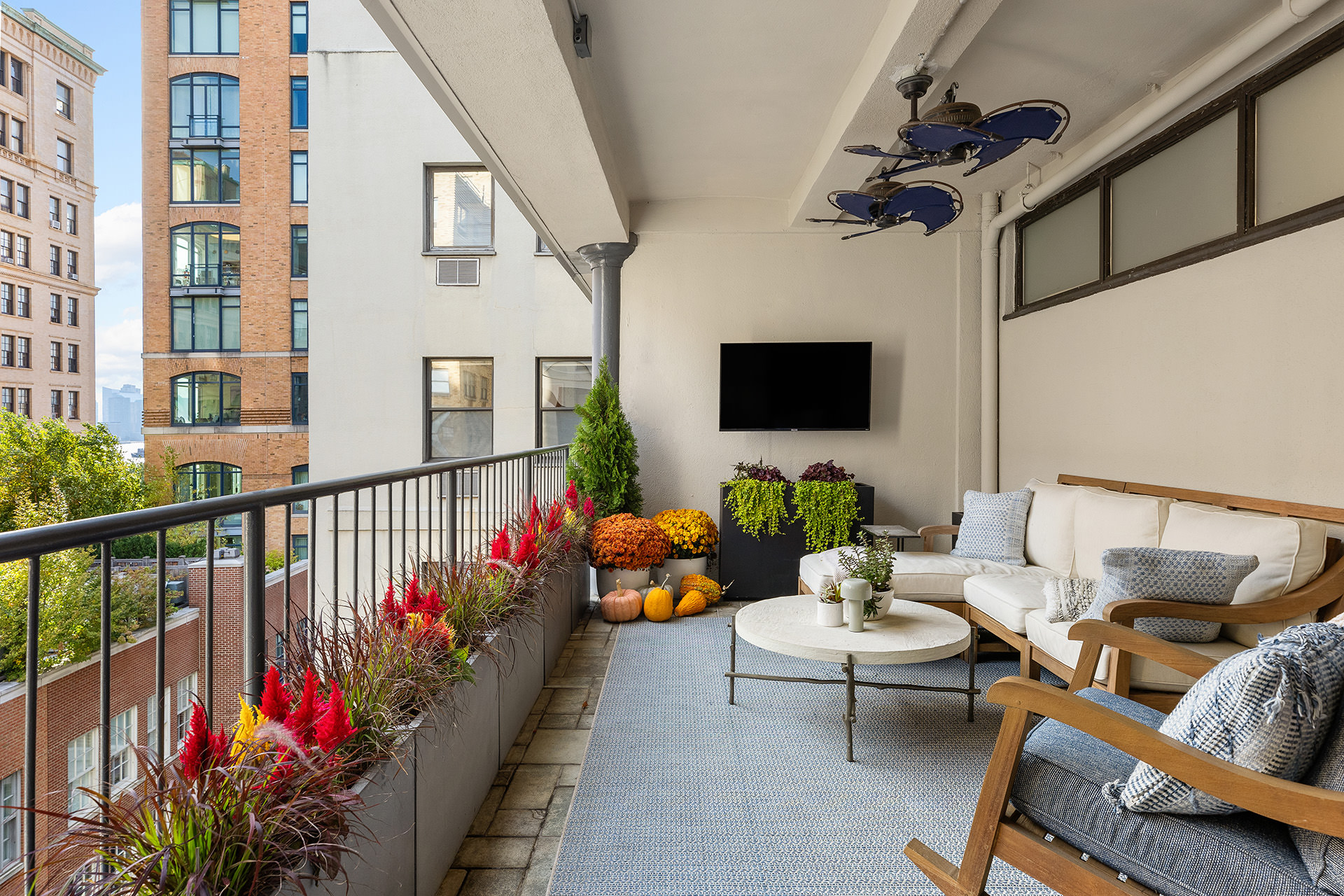 380 West 12th Street, Unit 6CD Manhattan, NY 10014 - Photo 3 of 19 a balcony with furniture potted plants