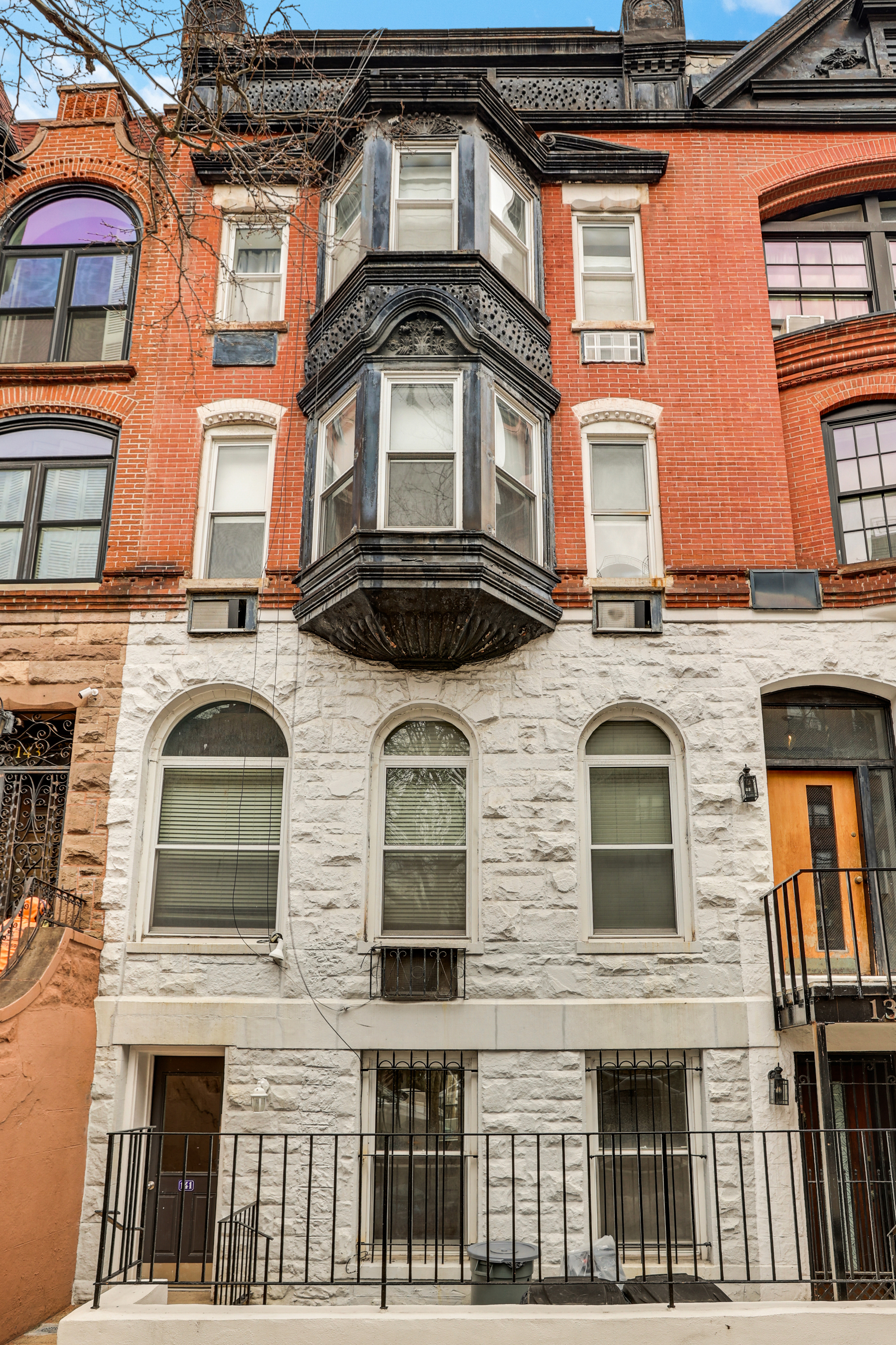 141 West 94th Street, Unit 1F Manhattan, NY 10025 - Photo 1 of 9 a front view of a building with a lot of windows