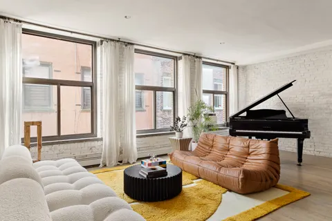 a living room with furniture and a window