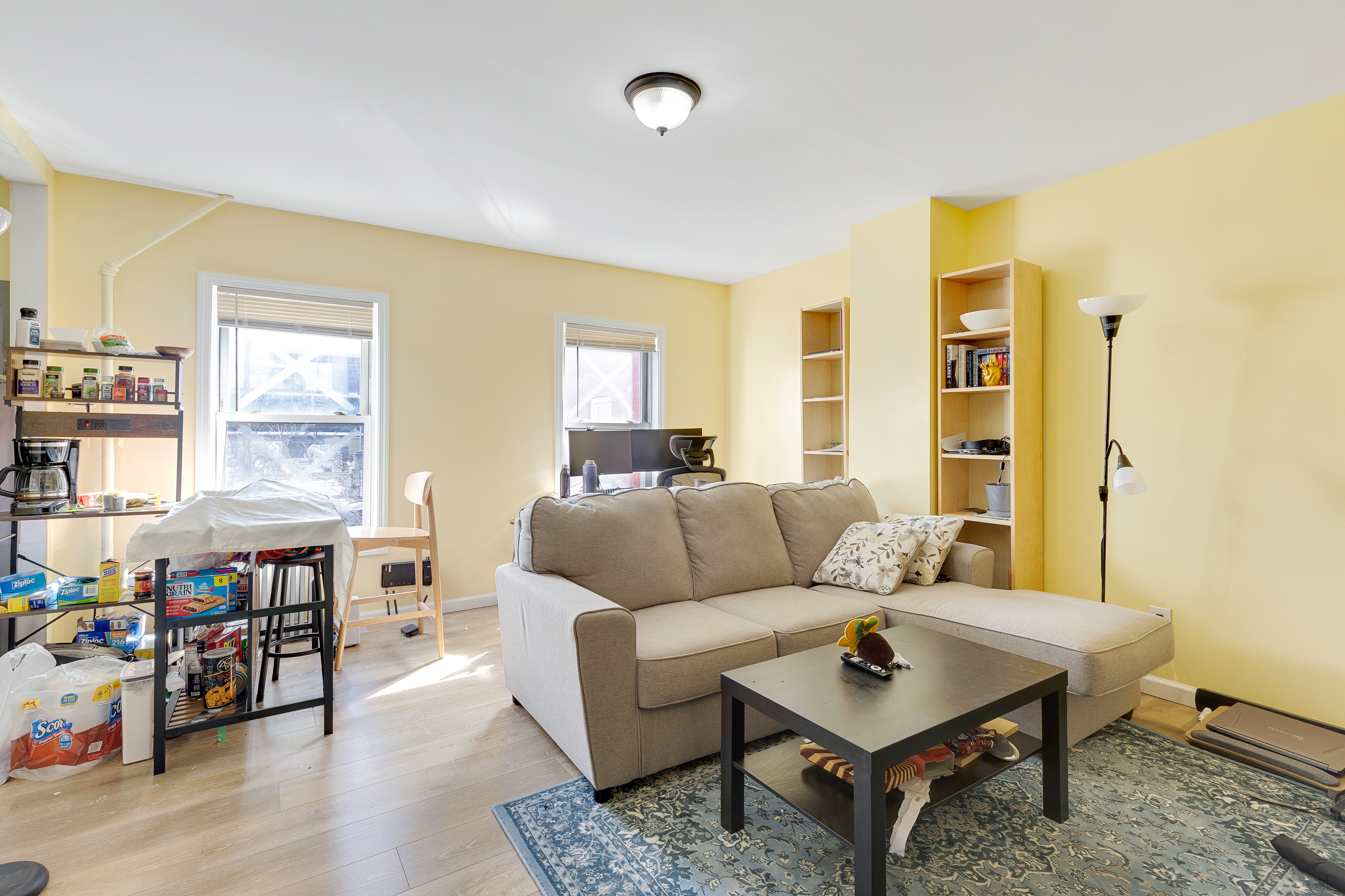35-47 30th Street Queens, NY 11106 - Photo 5 of 14 a living room with furniture and a window