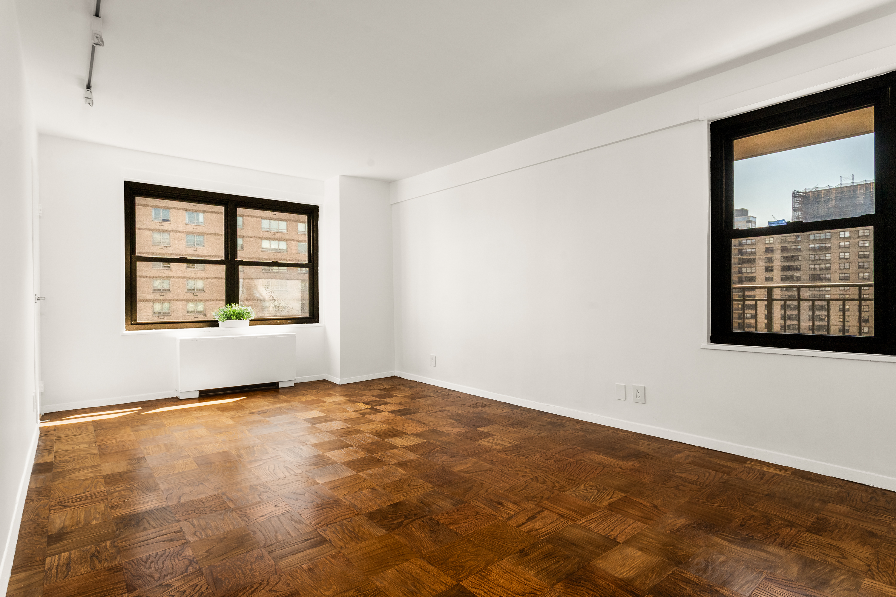 180 West End Avenue, Unit 23D Manhattan, NY 10023 - Photo 10 of 22 an empty room with windows