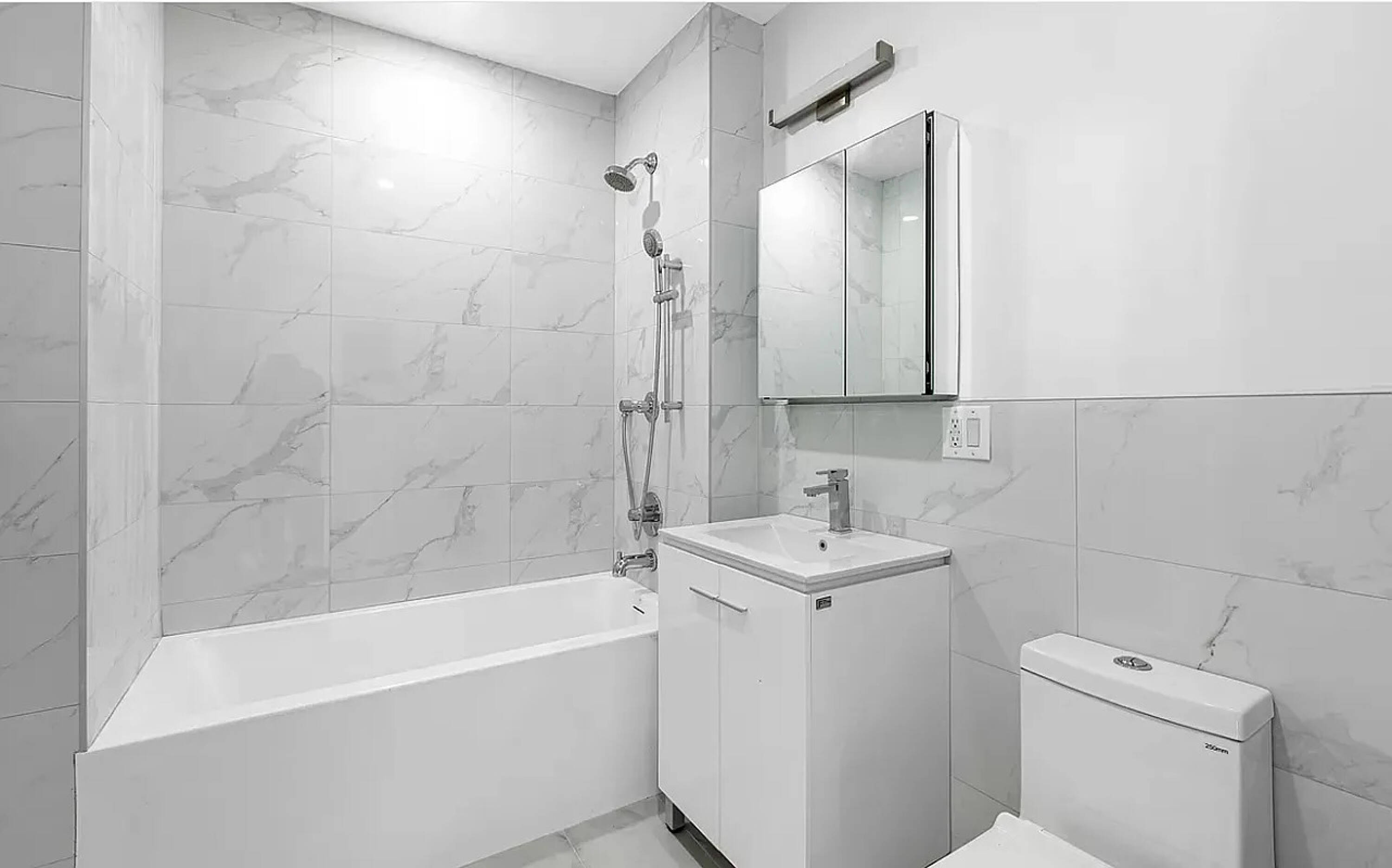 485 East 28th Street Brooklyn, NY 11226 - Photo 13 of 17 a bathroom with a sink a toilet and shower