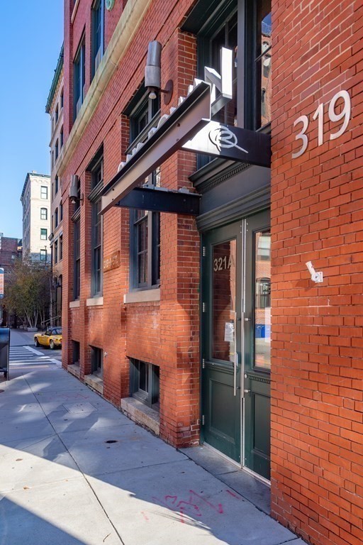 319 A Street, Unit 211 Boston, MA 02210 - Photo 16 of 24 a front view of a building with parking space