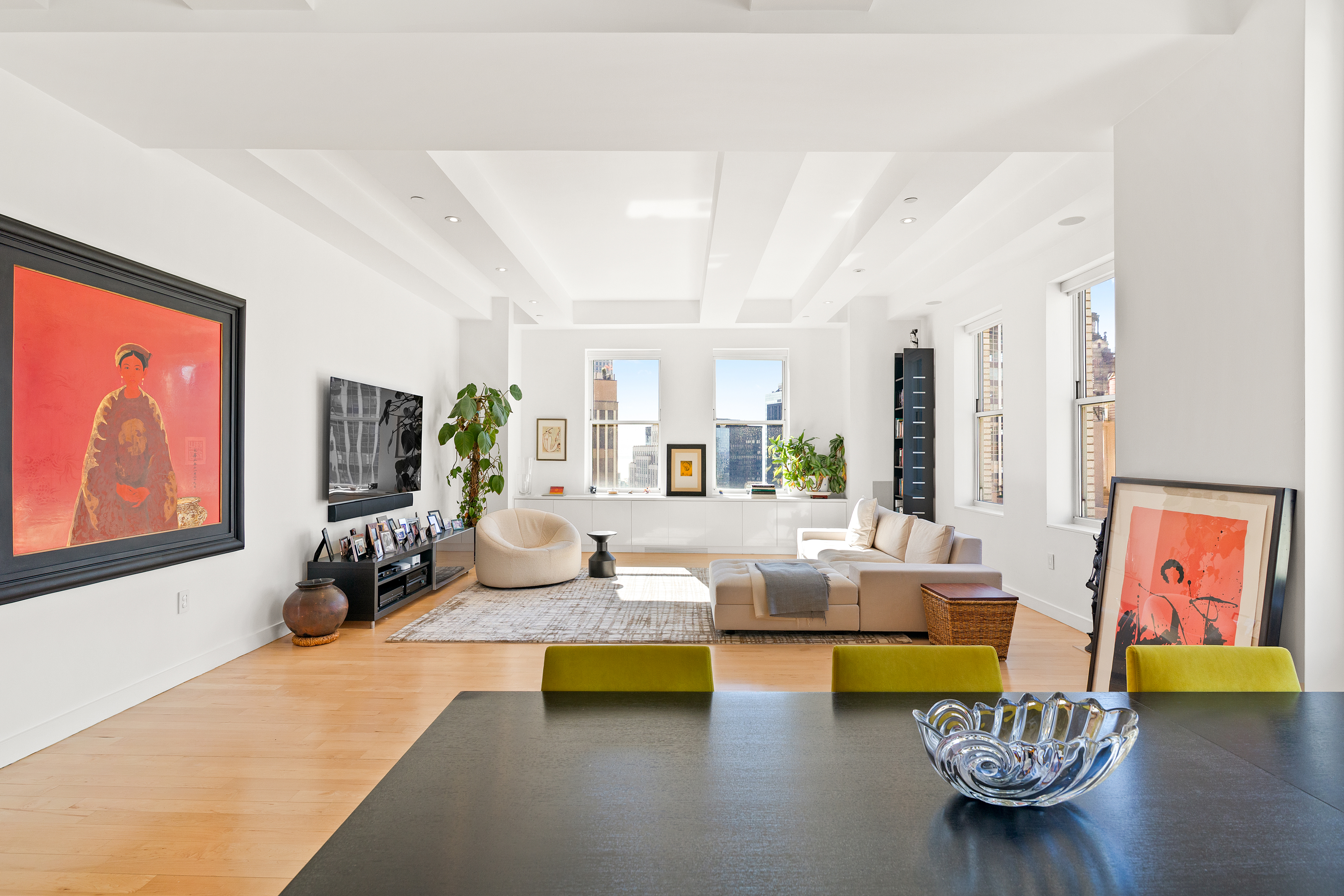 15 Broad Street, Unit 3120 Manhattan, NY 10005 - Photo 1 of 15 a living room with furniture and a flat screen tv