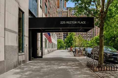 a view of outdoor space with wooden floor and sign board