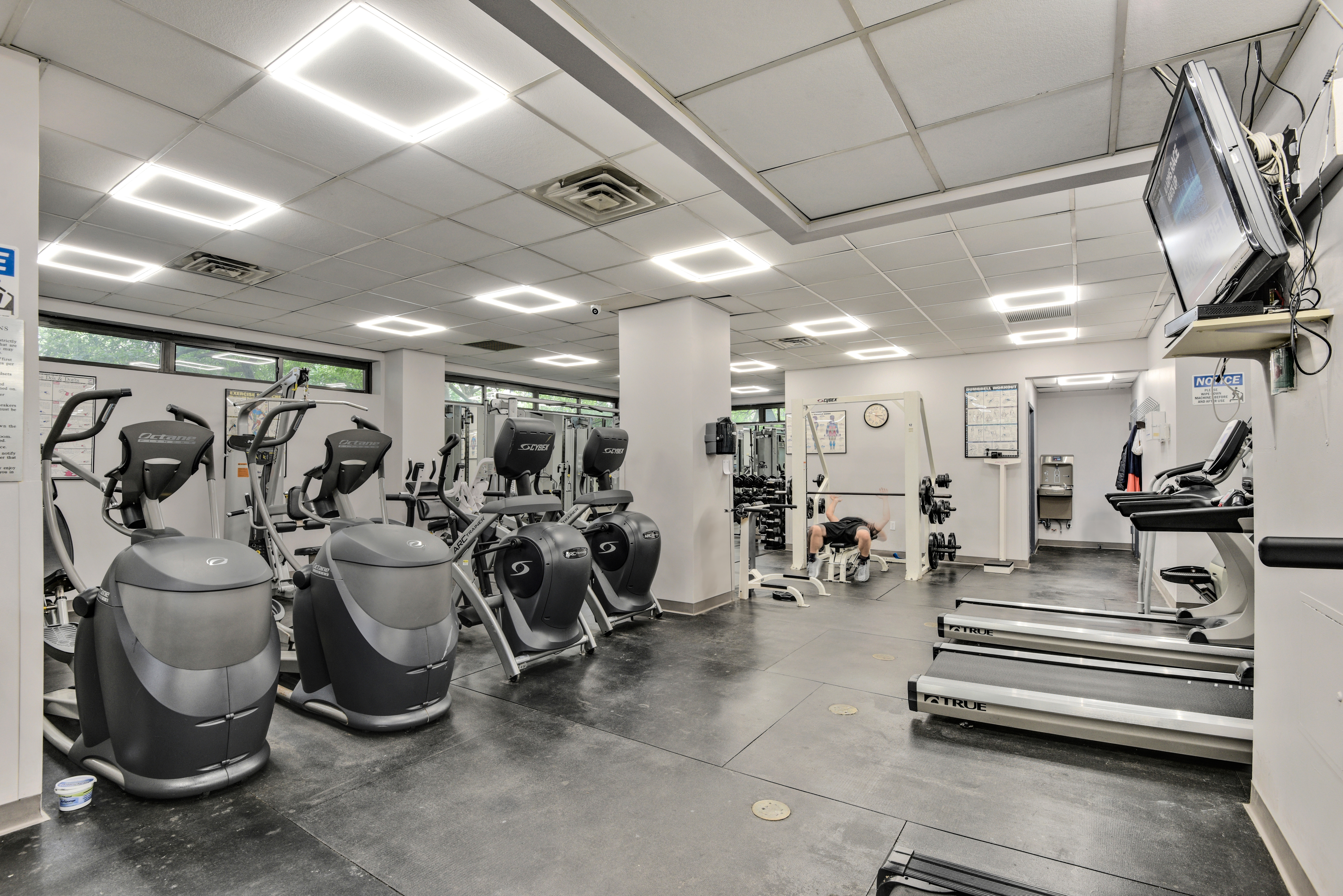 208 East Broadway, Unit J1304 Manhattan, NY 10002 - Photo 13 of 19 a view of a room with gym equipment