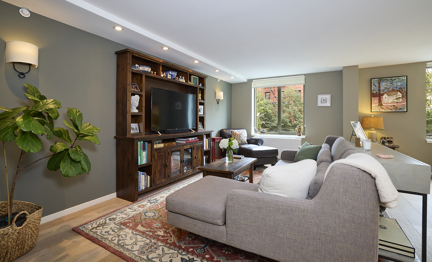 101 West 87th Street, Unit 205 Manhattan, NY 10024 - Photo 3 of 14 a living room with furniture and a flat screen tv