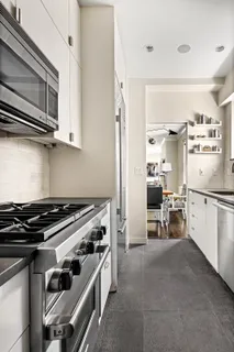 a kitchen with a stove and a microwave