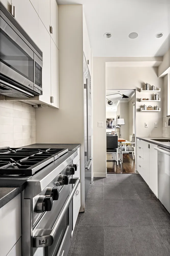 a kitchen with a stove and a microwave