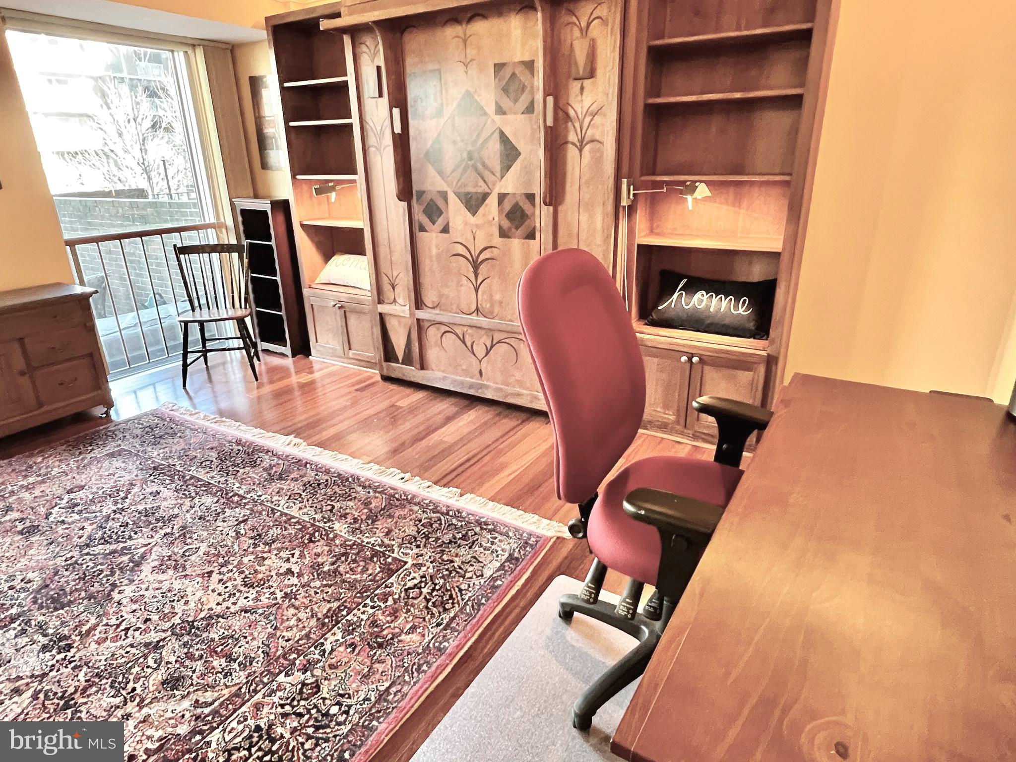 520 N Street Southwest, Unit S112 Washington, DC 20024 - Photo 12 of 45 a view of a workspace with furniture and a window