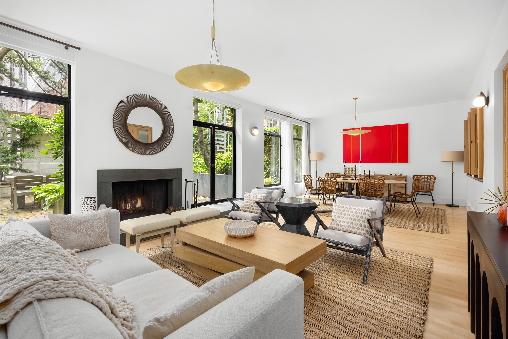 134 Charles Street Manhattan, NY 10014 - Photo 1 of 10 a living room with furniture a fireplace and a large window