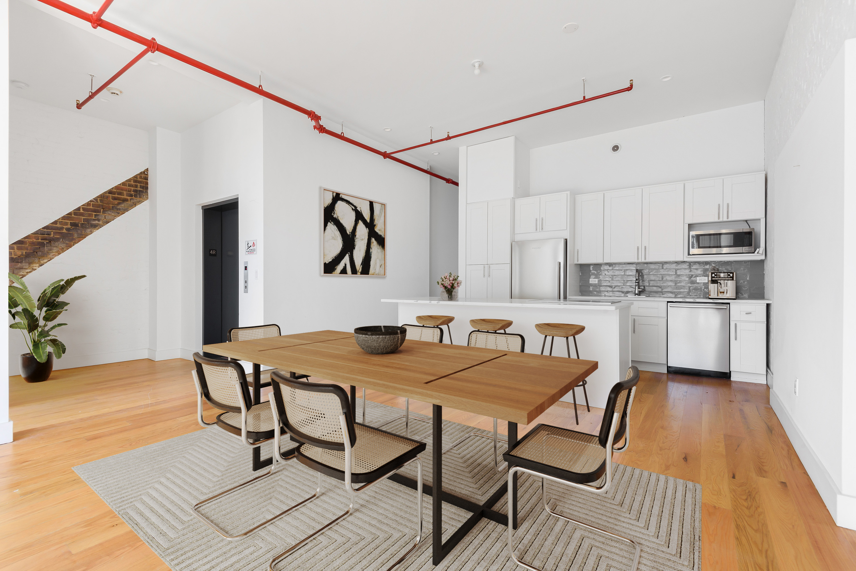 103 Broadway, Unit 4 Brooklyn, NY 11249 - Photo 2 of 7 a view of a dining room with furniture and wooden floor