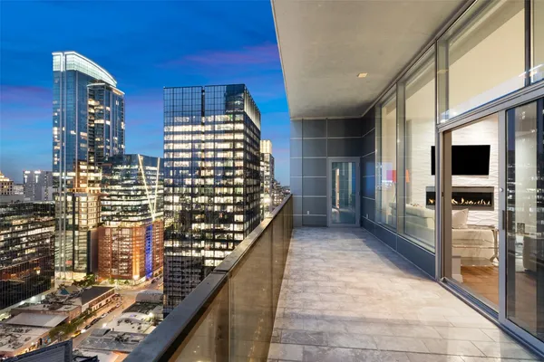 a view of balcony with wooden floor