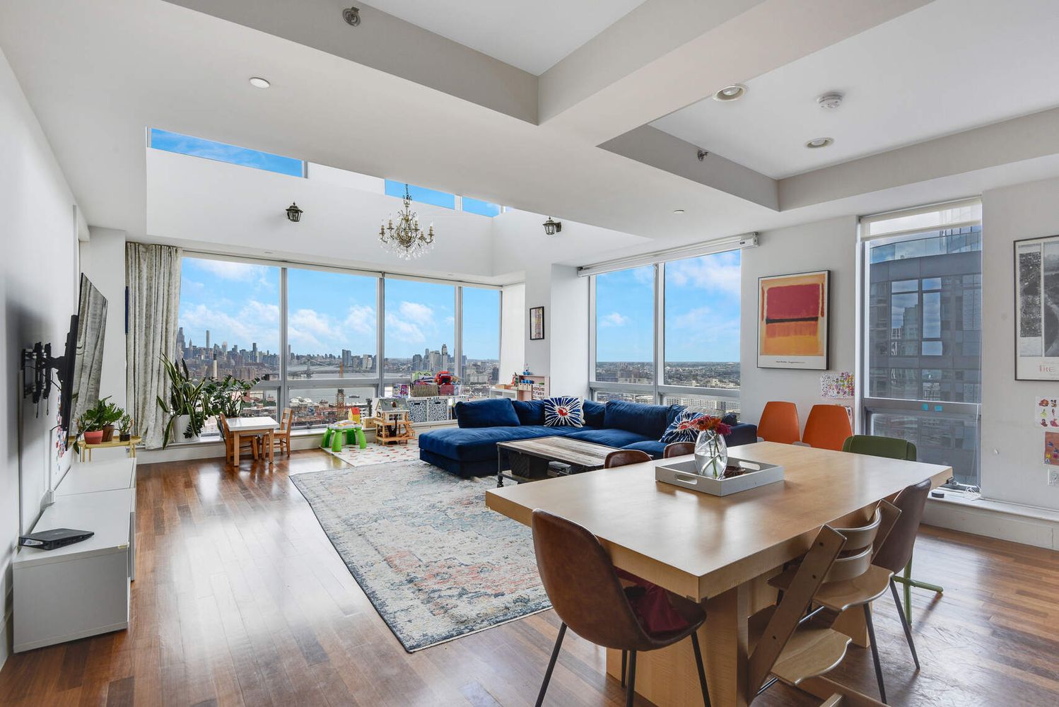 150 Myrtle Avenue, Unit PH3201 Brooklyn, NY 11201 - Photo 3 of 40 a view of a dining room with furniture and wooden floor