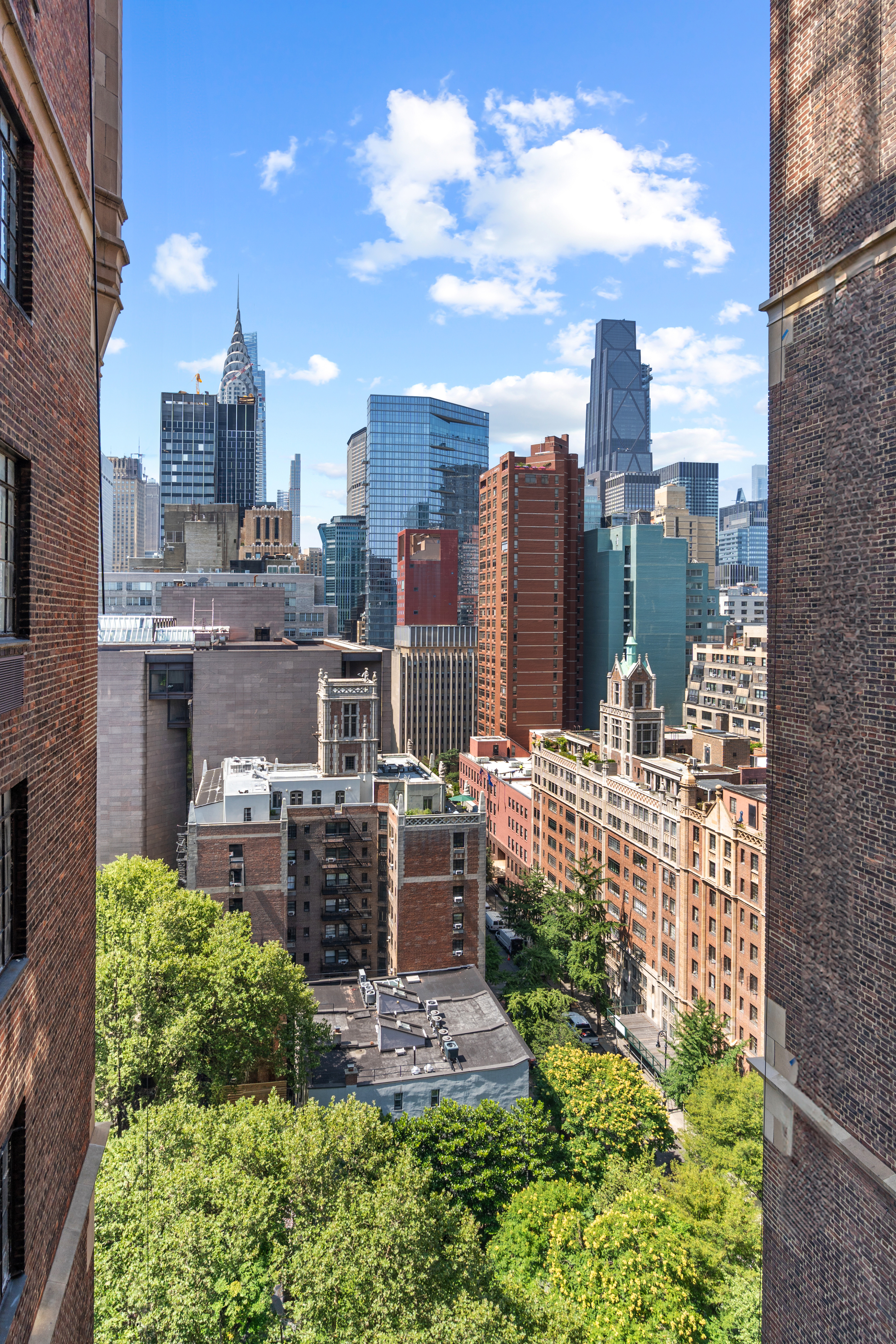 45 Tudor City Place, Unit 1708 Manhattan, NY 10017 - Photo 3 of 14 a view of a city with tall buildings