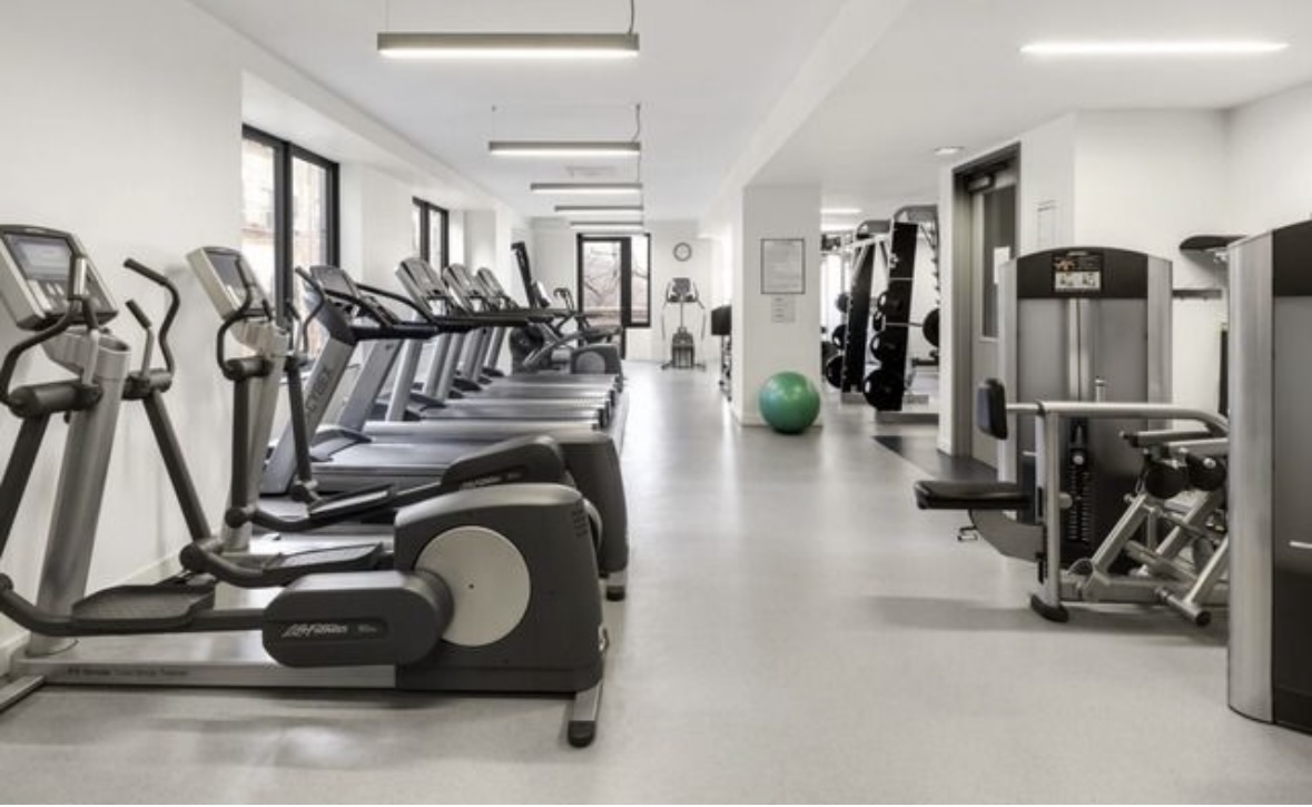450 East 83rd Street, Unit 4H Manhattan, NY 10028 - Photo 10 of 16 a view of a room with gym equipment