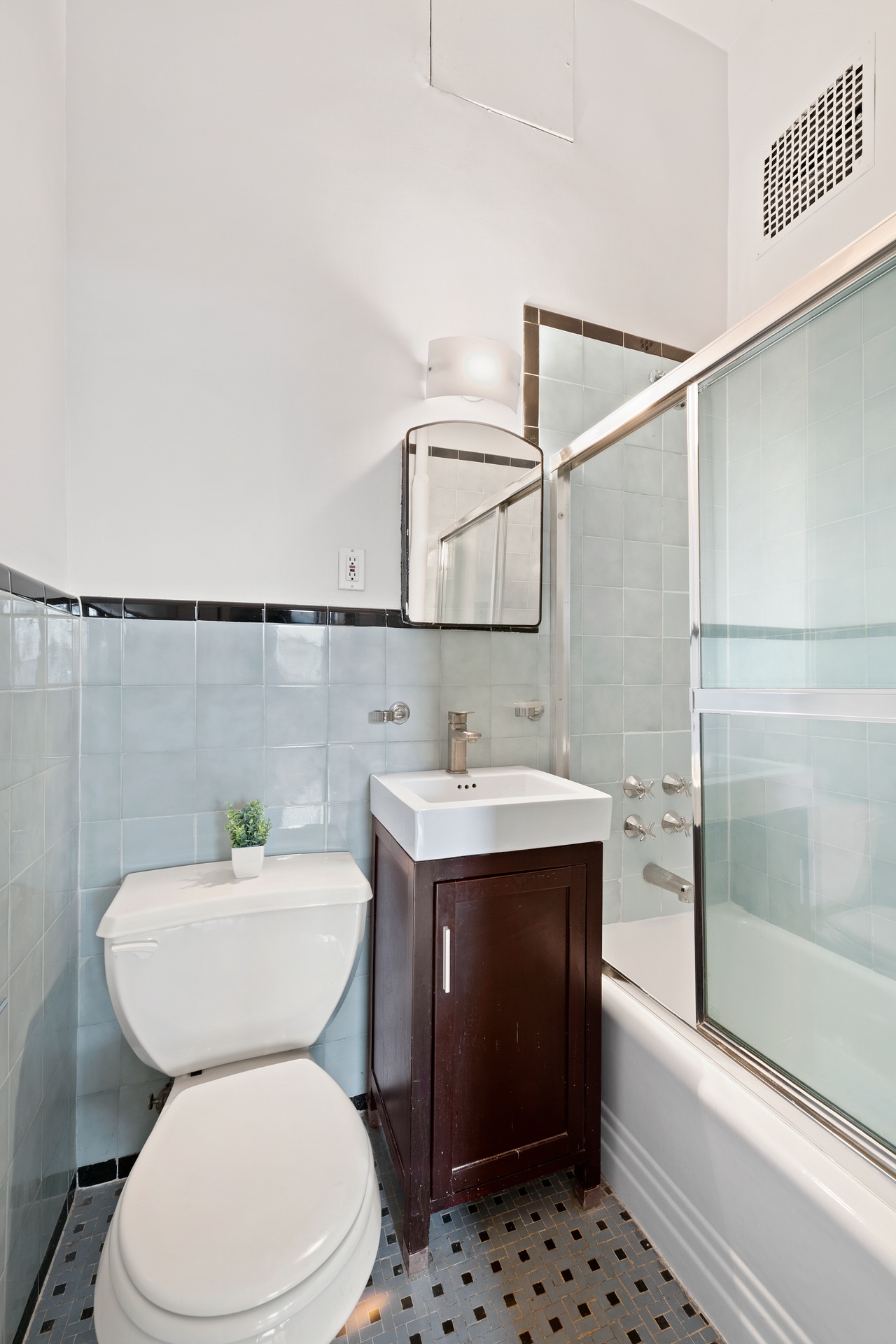 293 Riverside Drive, Unit 2A Manhattan, NY 10025 - Photo 5 of 6 a bathroom with a sink a toilet and shower