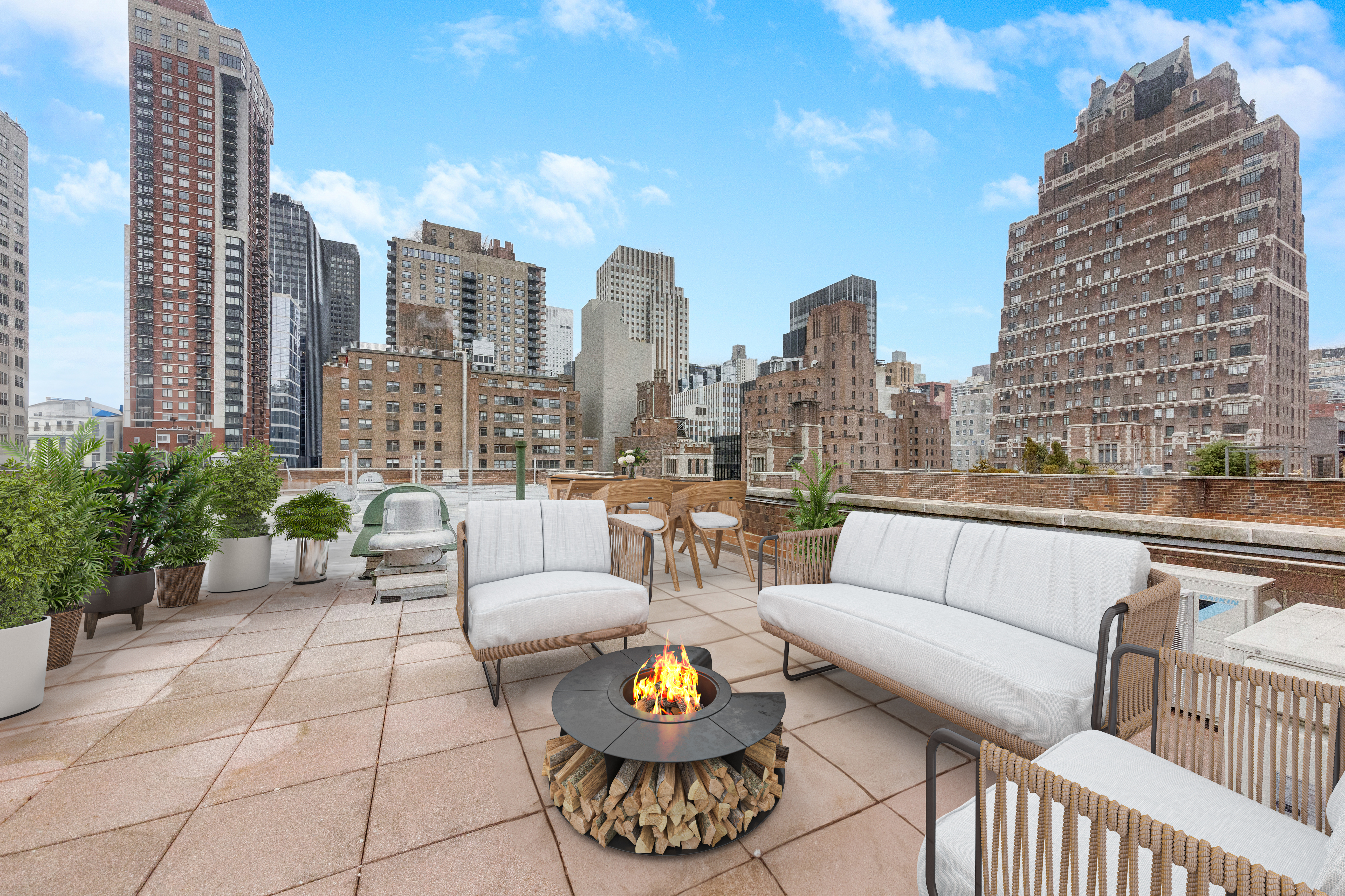 2 Tudor City Place, Unit 12DS Manhattan, NY 10017 - Photo 5 of 20 a view of a terrace with couches and a potted plant