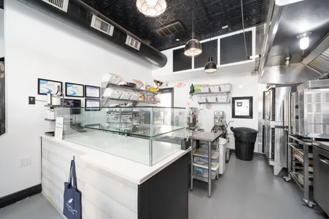 a kitchen with stainless steel appliances lots of counter space and breakfast area