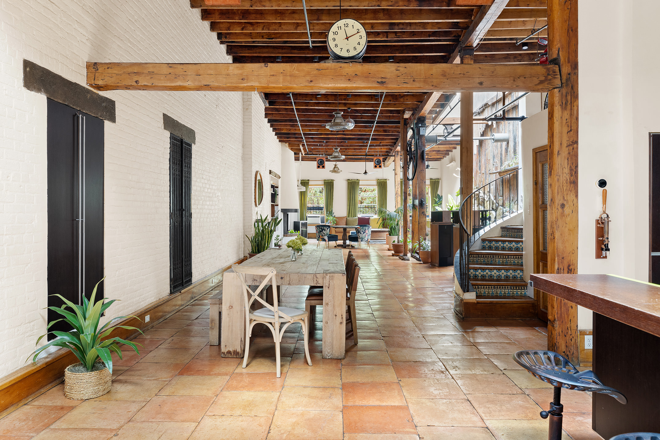 170 Eldridge Street Manhattan, NY 10002 - Photo 7 of 19 a view of a patio with table and chairs potted plants with wooden floor and fence