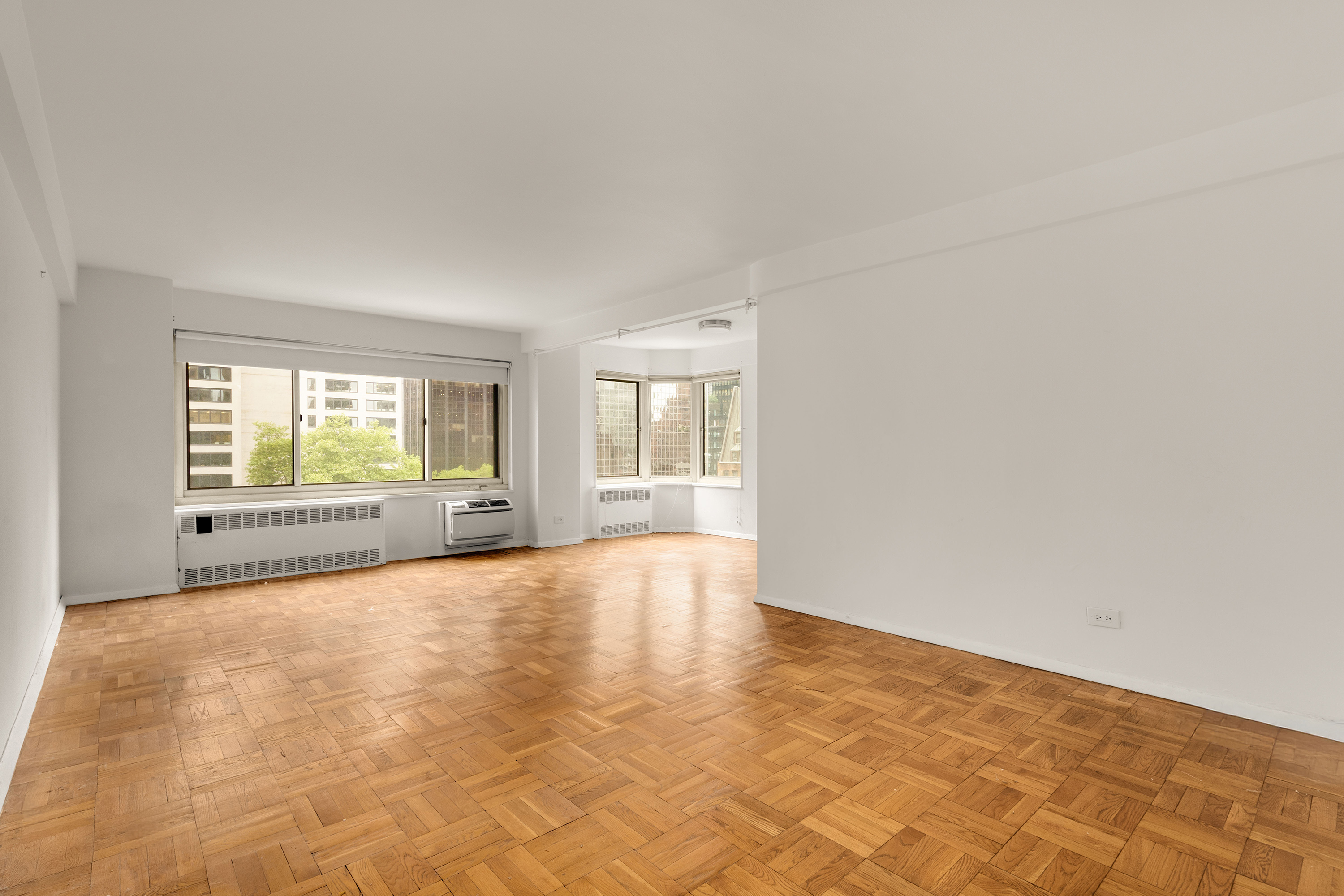 249 East 48th Street, Unit 12A Manhattan, NY 10017 - Photo 3 of 9 a view of an empty room with a window