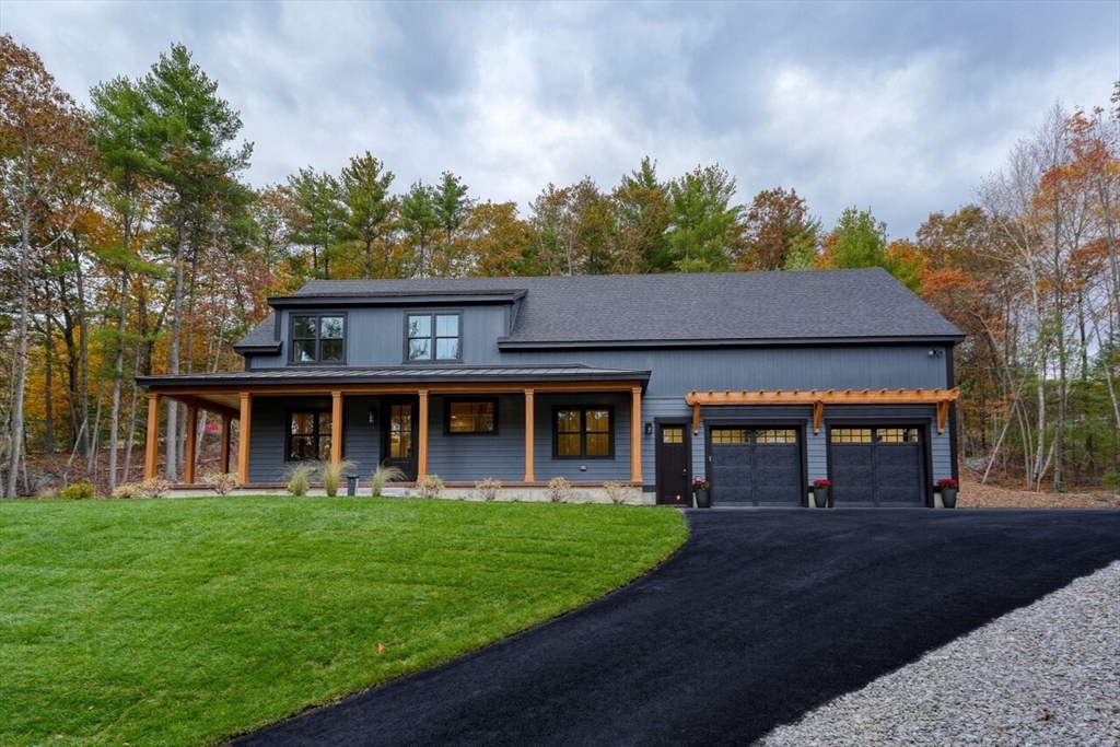171 Randall Road Berlin, MA 01503 - Photo 2 of 41 a front view of a house with garden