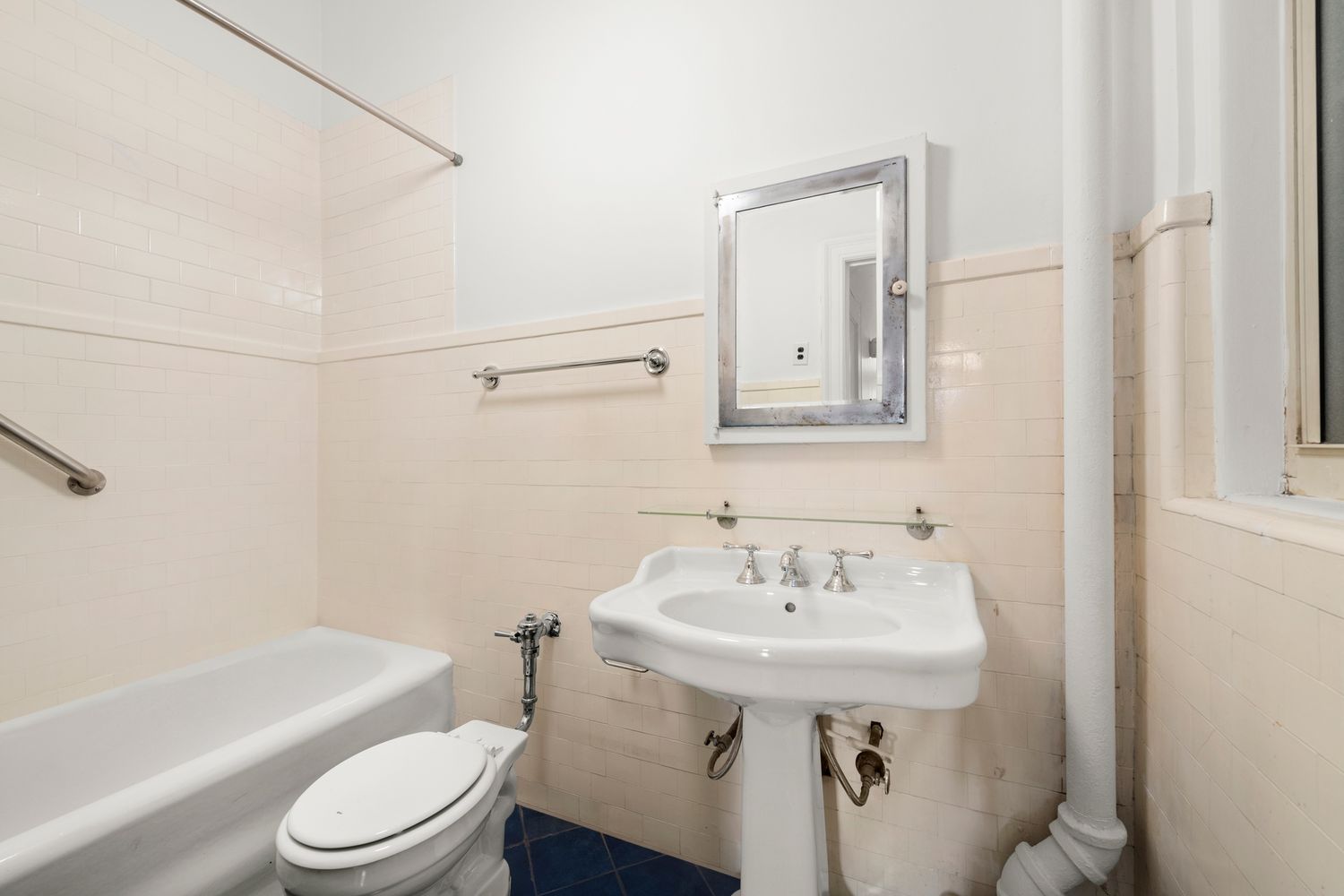 a bathroom with a sink toilet and bathtub