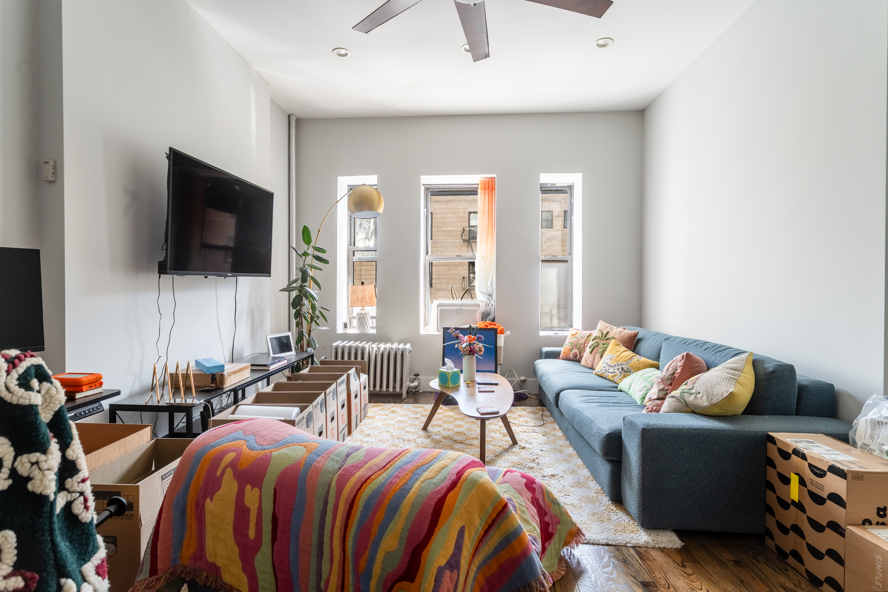 944 Marcy Avenue, Unit 3D Brooklyn, NY 11216 - Photo 4 of 9 a living room with furniture and a flat screen tv