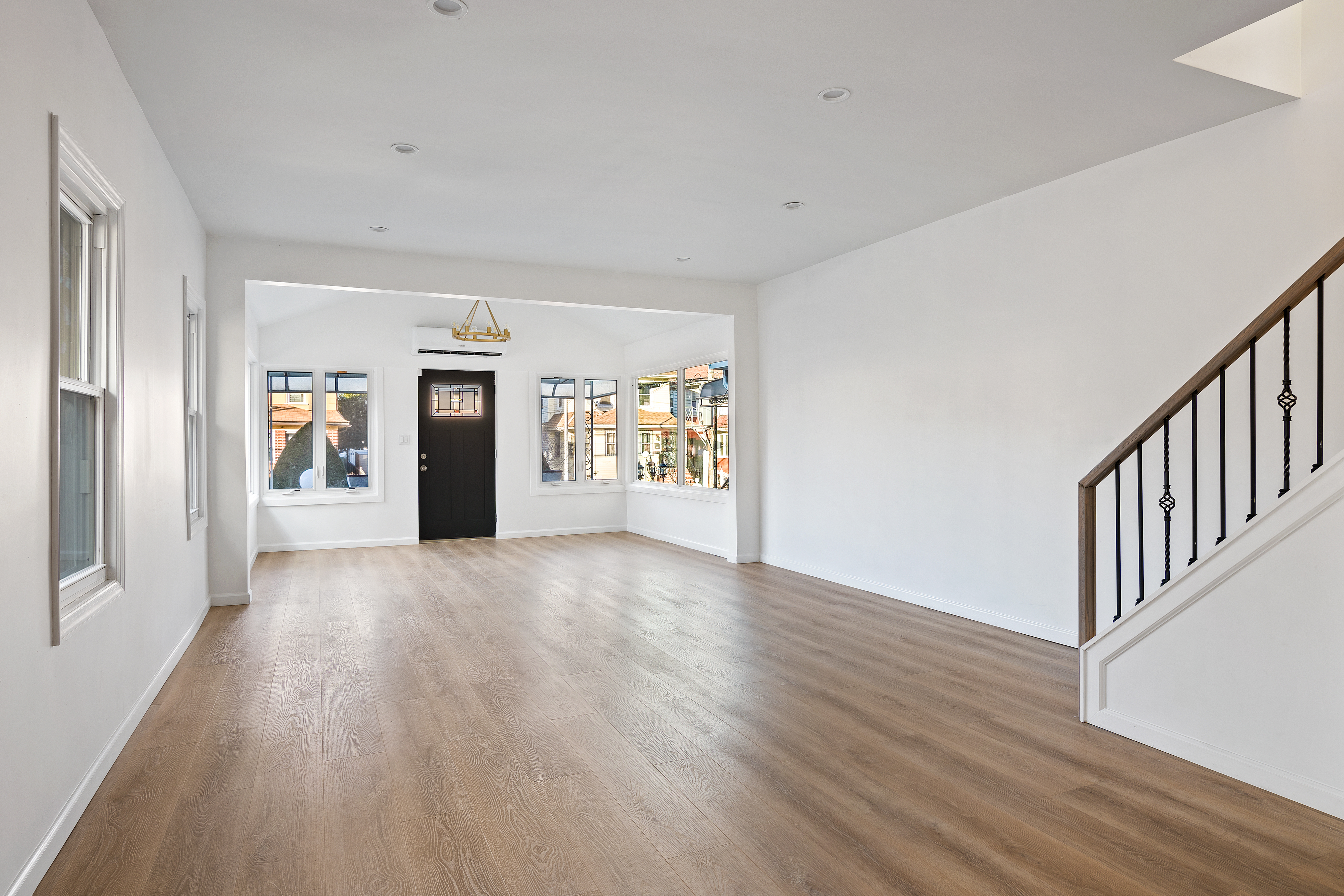 3810 Farragut Road, Unit 1 Brooklyn, NY 11210 - Photo 3 of 13 a view of an empty room with window and wooden floor