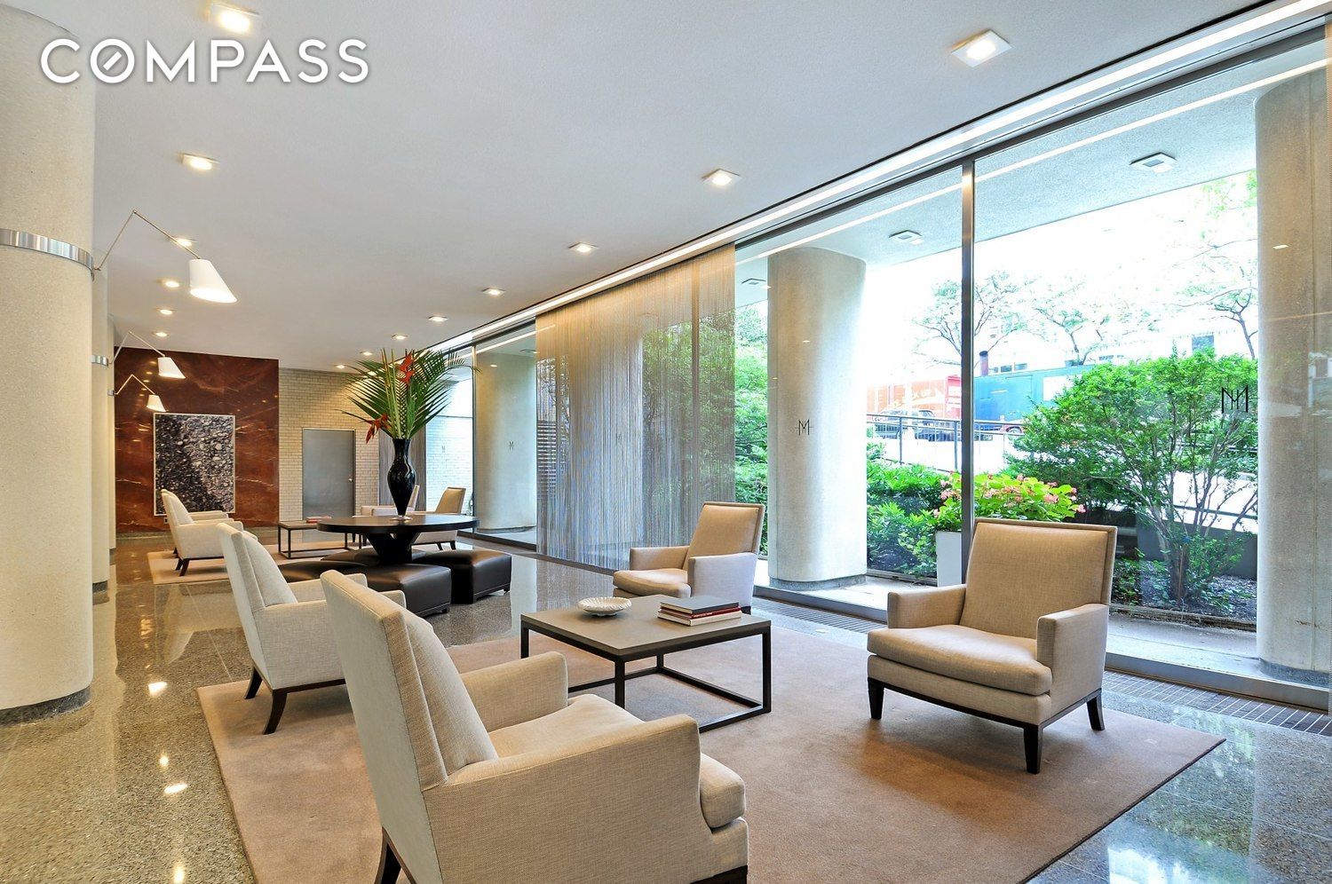 200 East 66th Street, Unit D1205 Manhattan, NY 10065 - Photo 19 of 33 a living room with furniture and large windows