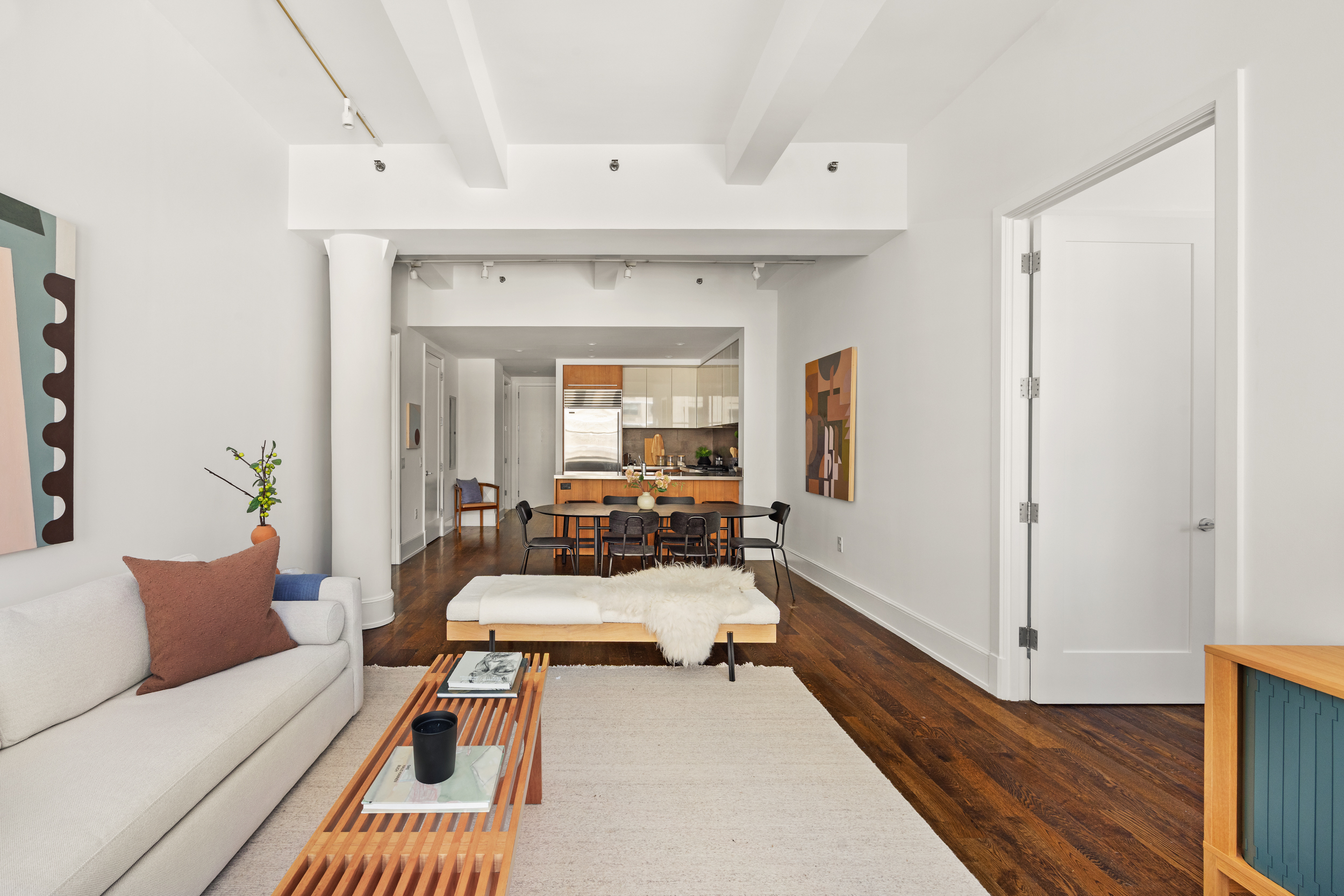 260 Park Avenue South, Unit 9G Manhattan, NY 10010 - Photo 4 of 17 a living room with furniture and a wooden floor