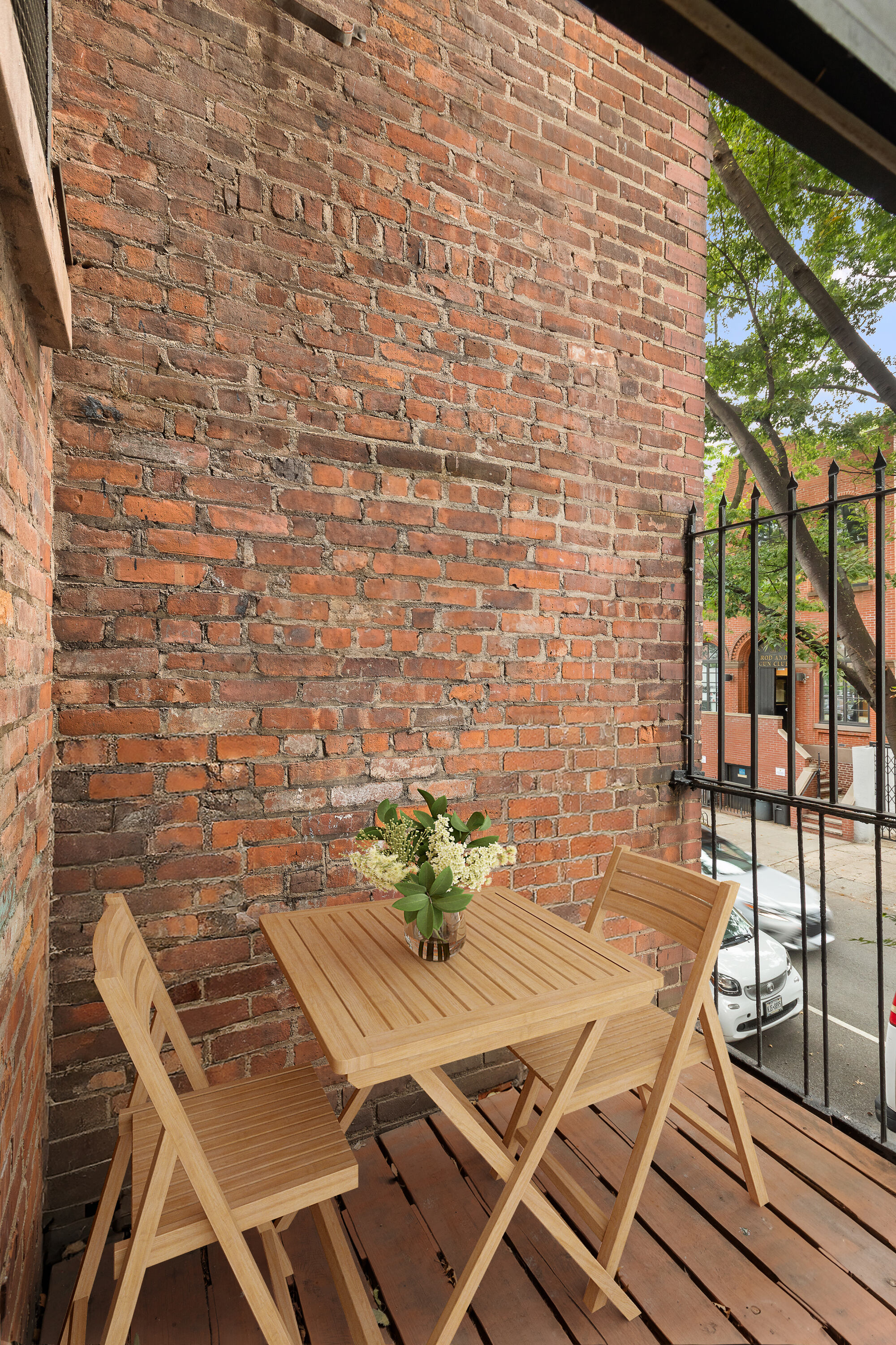 199 Clinton Street, Unit 2 Brooklyn, NY 11201 - Photo 16 of 17 a view of a balcony with table and chairs