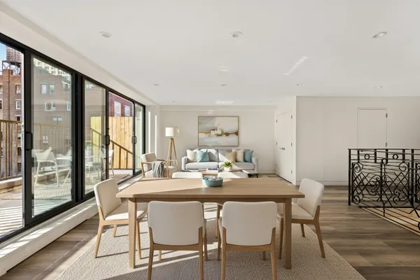 a view of a dining room with furniture window and outside view