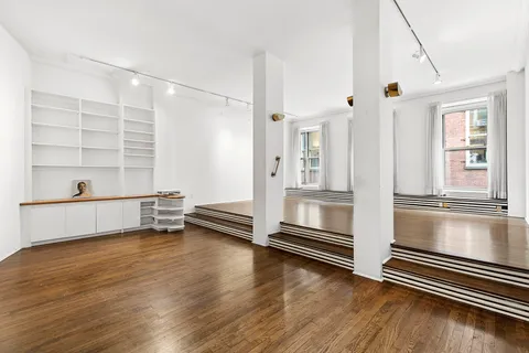 a view of a living room and hardwood floor