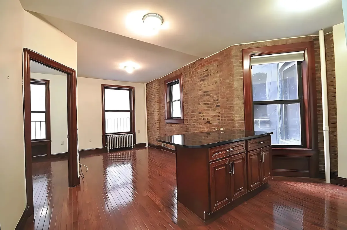 a kitchen with stainless steel appliances granite countertop a refrigerator and a stove