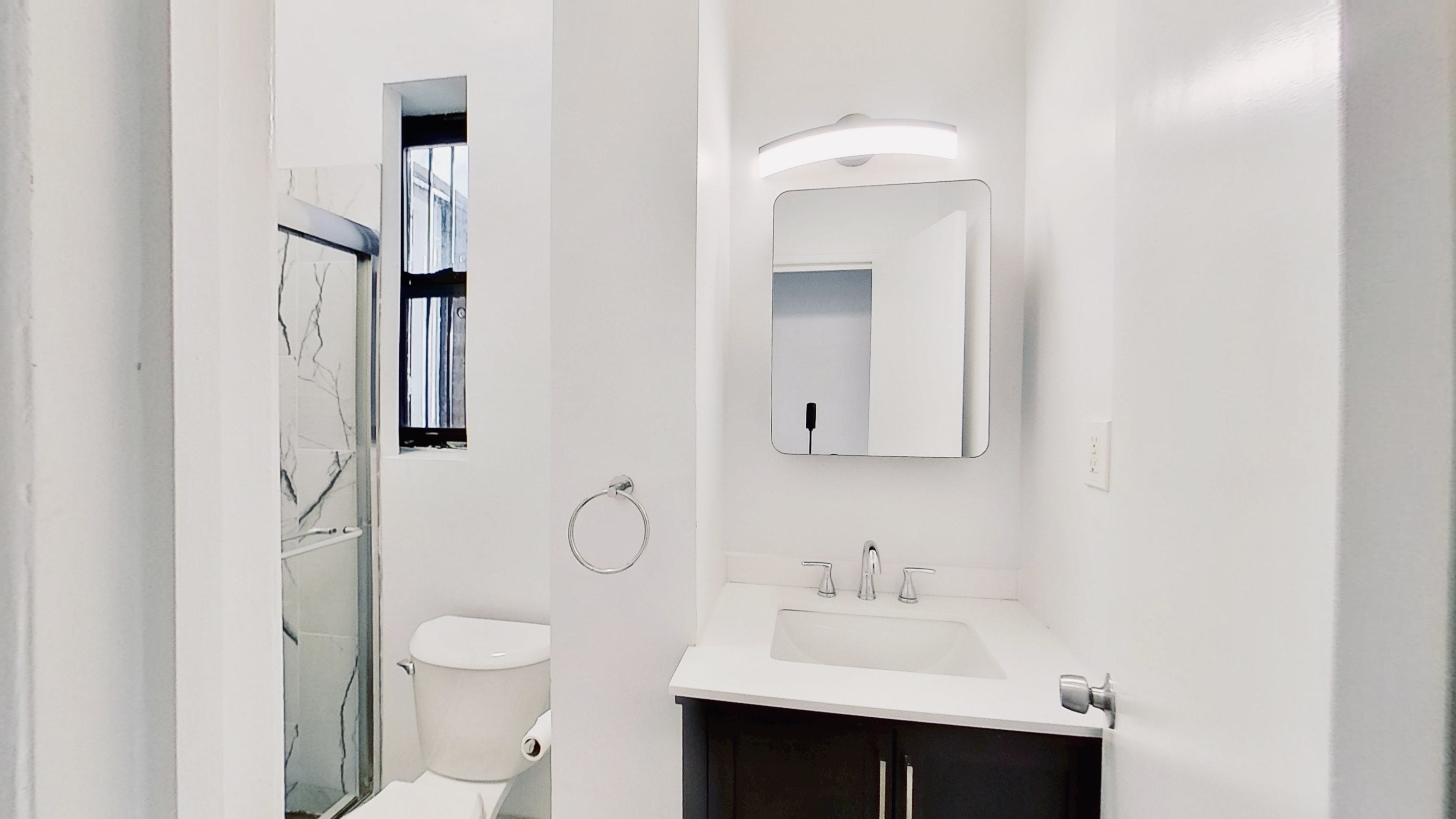 347 5th Avenue, Unit 1L Brooklyn, NY 11215 - Photo 7 of 10 a bathroom with a sink toilet and mirror
