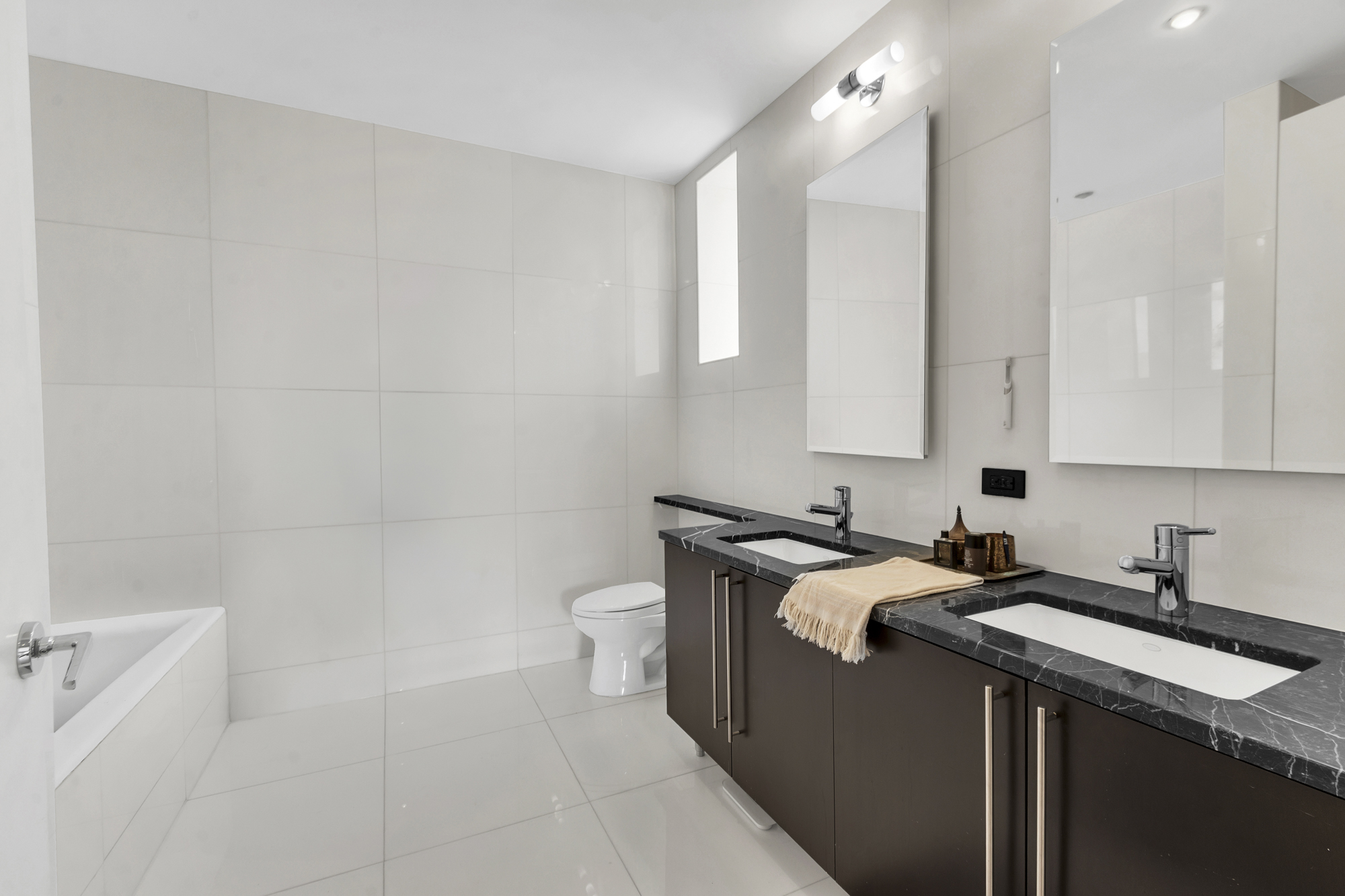 267 West 124th Street, Unit 6A Manhattan, NY 10027 - Photo 20 of 24 a bathroom with a sink a toilet and a mirror