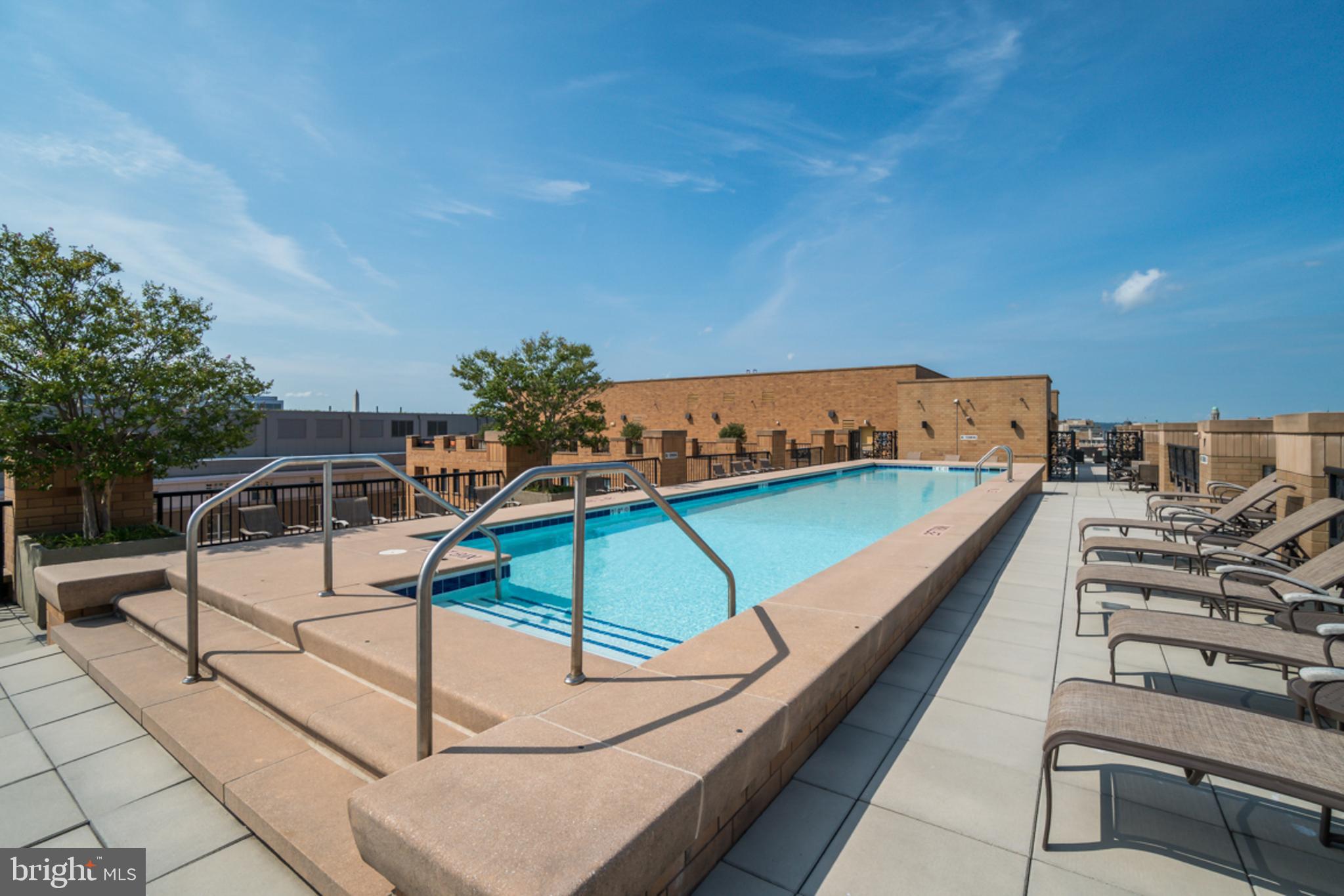 910 M Street Northwest, Unit 403 Washington, DC 20001 - Photo 21 of 31 a view of a swimming pool with a lounge chair
