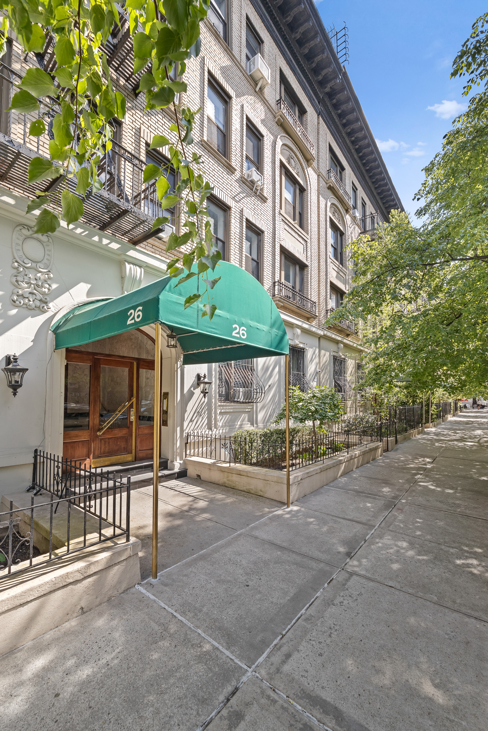 26 Butler Place, Unit 48 Brooklyn, NY 11238 - Photo 11 of 14 a view of a brick building with a bench in front of building