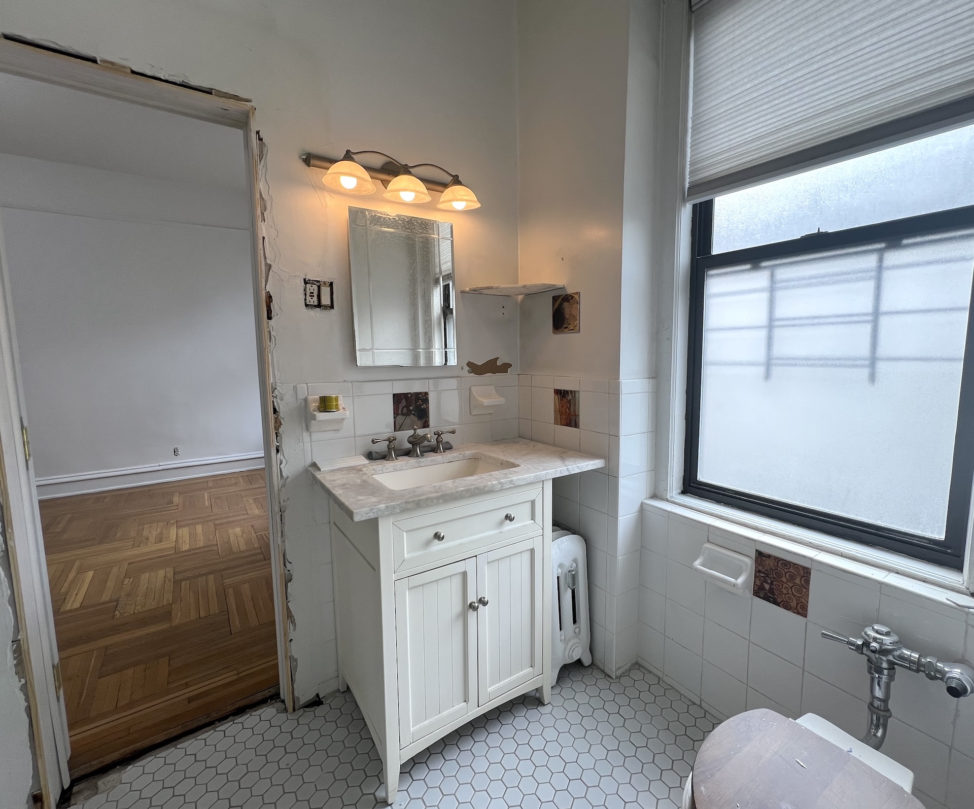 59 Livingston Street, Unit 3A Brooklyn, NY 11201 - Photo 6 of 19 a bathroom with a sink a vanity and a mirror