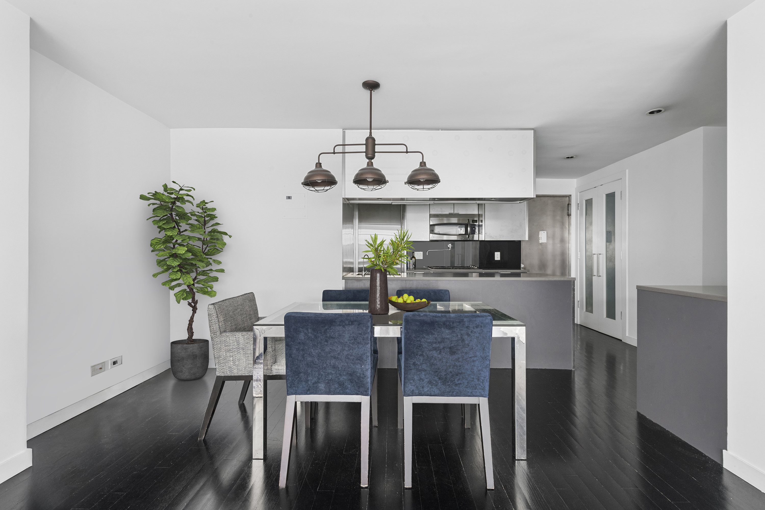 235 East 57th Street, Unit 5D Manhattan, NY 10022 - Photo 3 of 10 a view of a dining room with furniture window and wooden floor