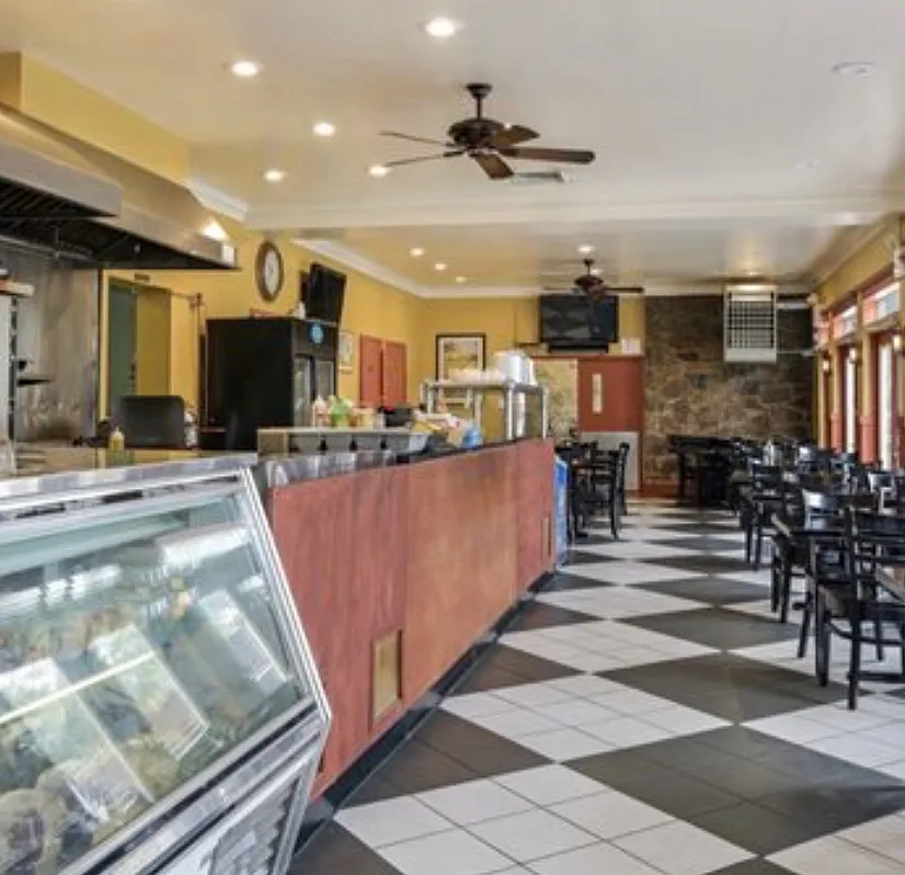 a sign that is sitting in front of flowers