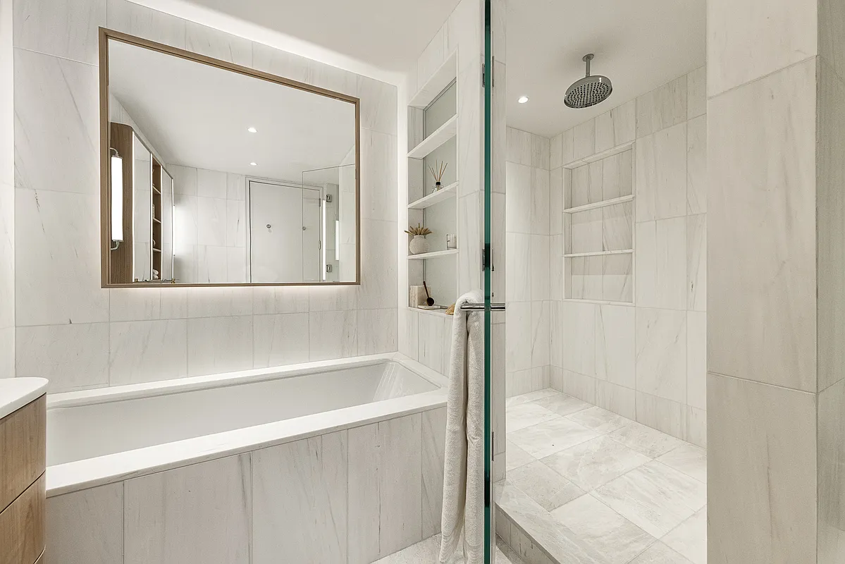 250 West 96th Street, Unit PHA Manhattan, NY 10025 - Photo 9 of 33 a bathroom with a bathtub and a shower