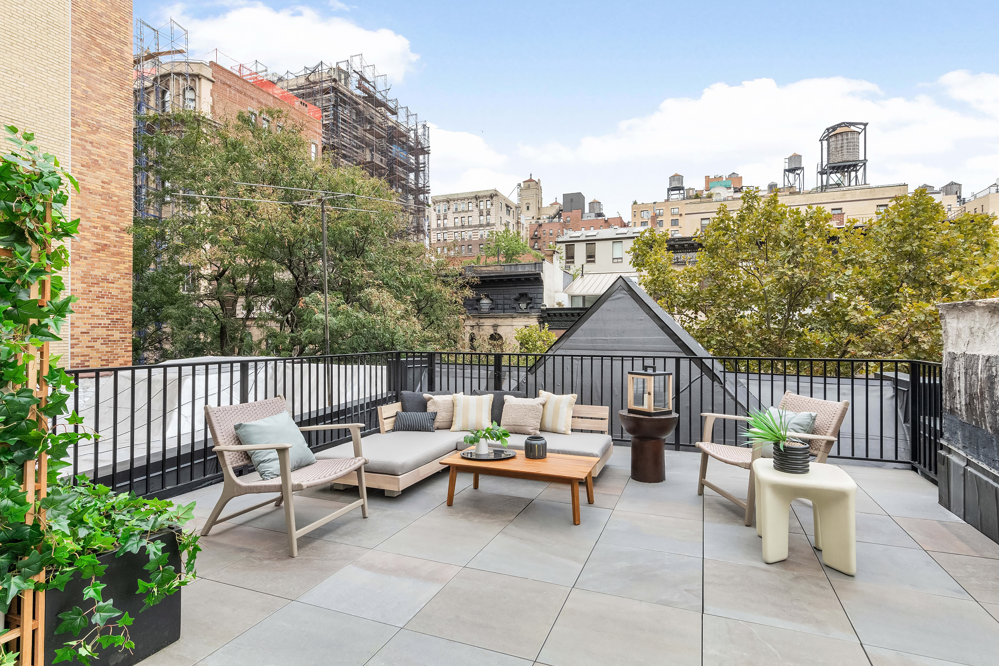 344 West 84th Street, Unit PH Manhattan, NY 10024 - Photo 10 of 11 a view of a patio with couches and a table and chairs with wooden fence